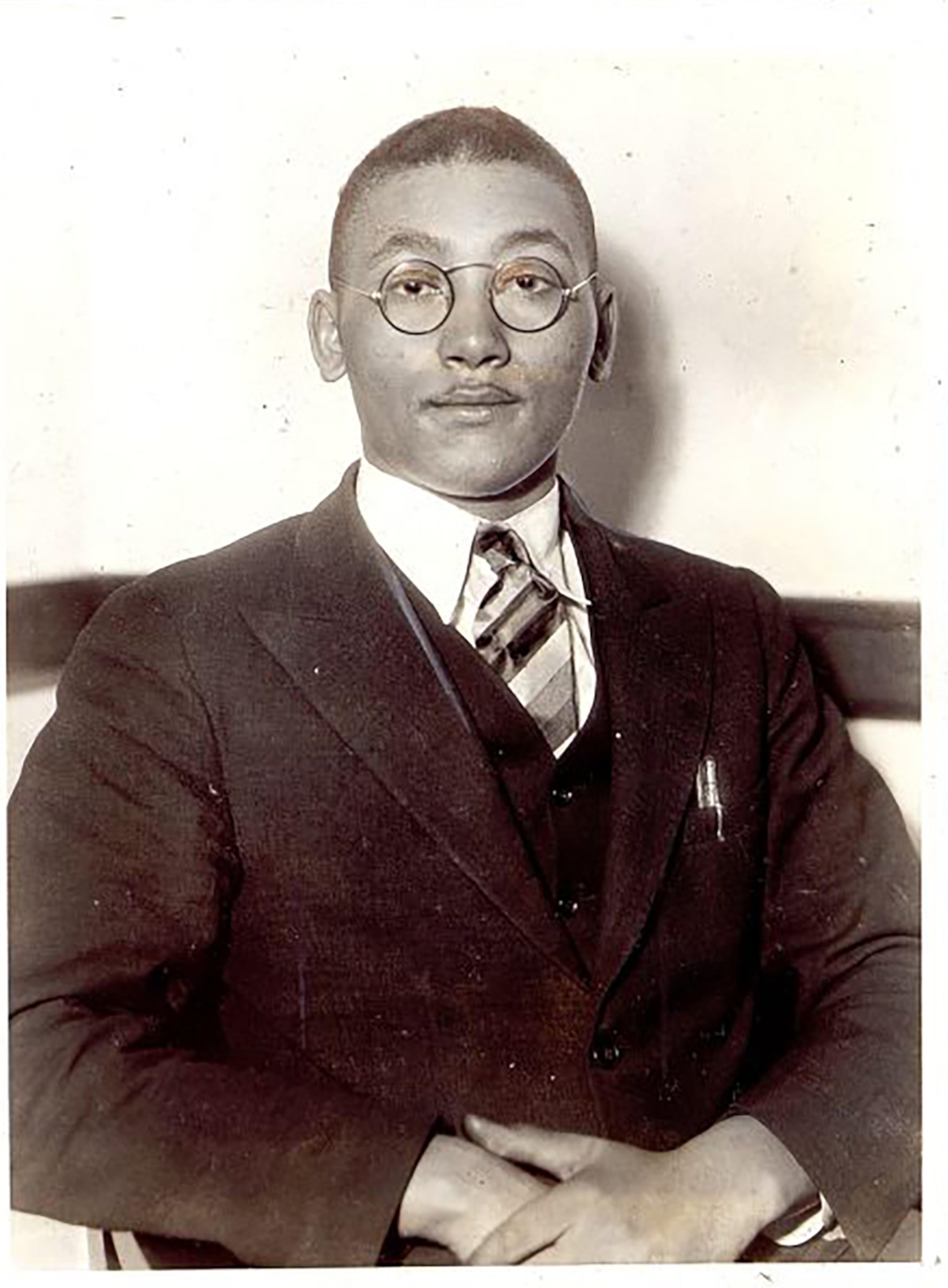 Angelo Herndon, 19, is shown in court in 1933, just before he was sentenced. He had come South with a message of Communism, but was convicted in Atlanta under a statute passed 60 years ago. He was sentenced to 18 to 20 years in prison. The jury found Herndon guilty after deliberating for more than two hours and recommended mercy. (The Associated Press)