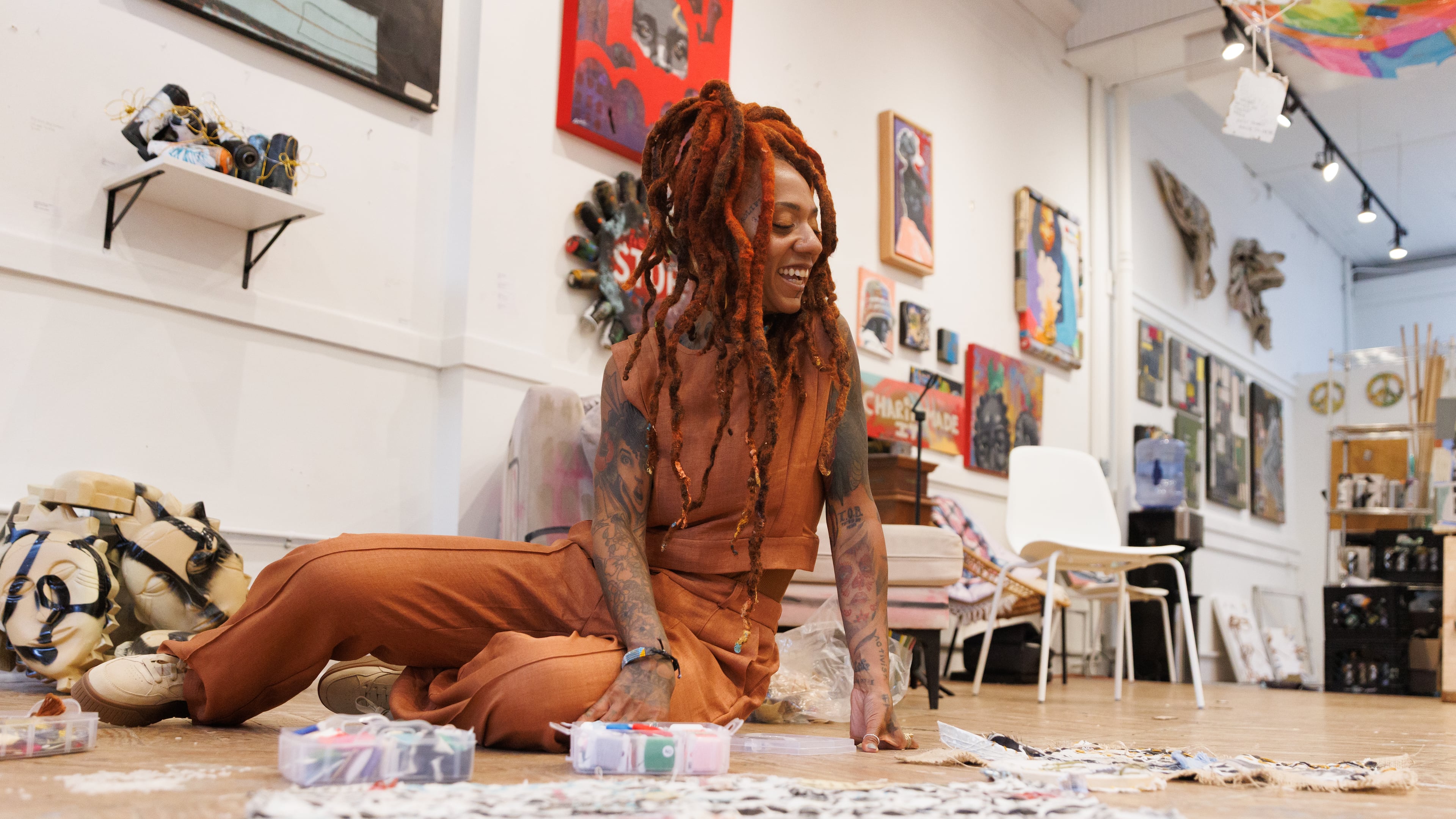 Multifaceted artist and muralist Charity Hamidullah splits her time between street artist and working in her studio in Midtown Atlanta, shown on Wednesday, May 27, 2026. Hamidullah currently uses photography and fabric to create collages with patterns of identity, impression, connection and growth. (Estela Muñoz/AJC)