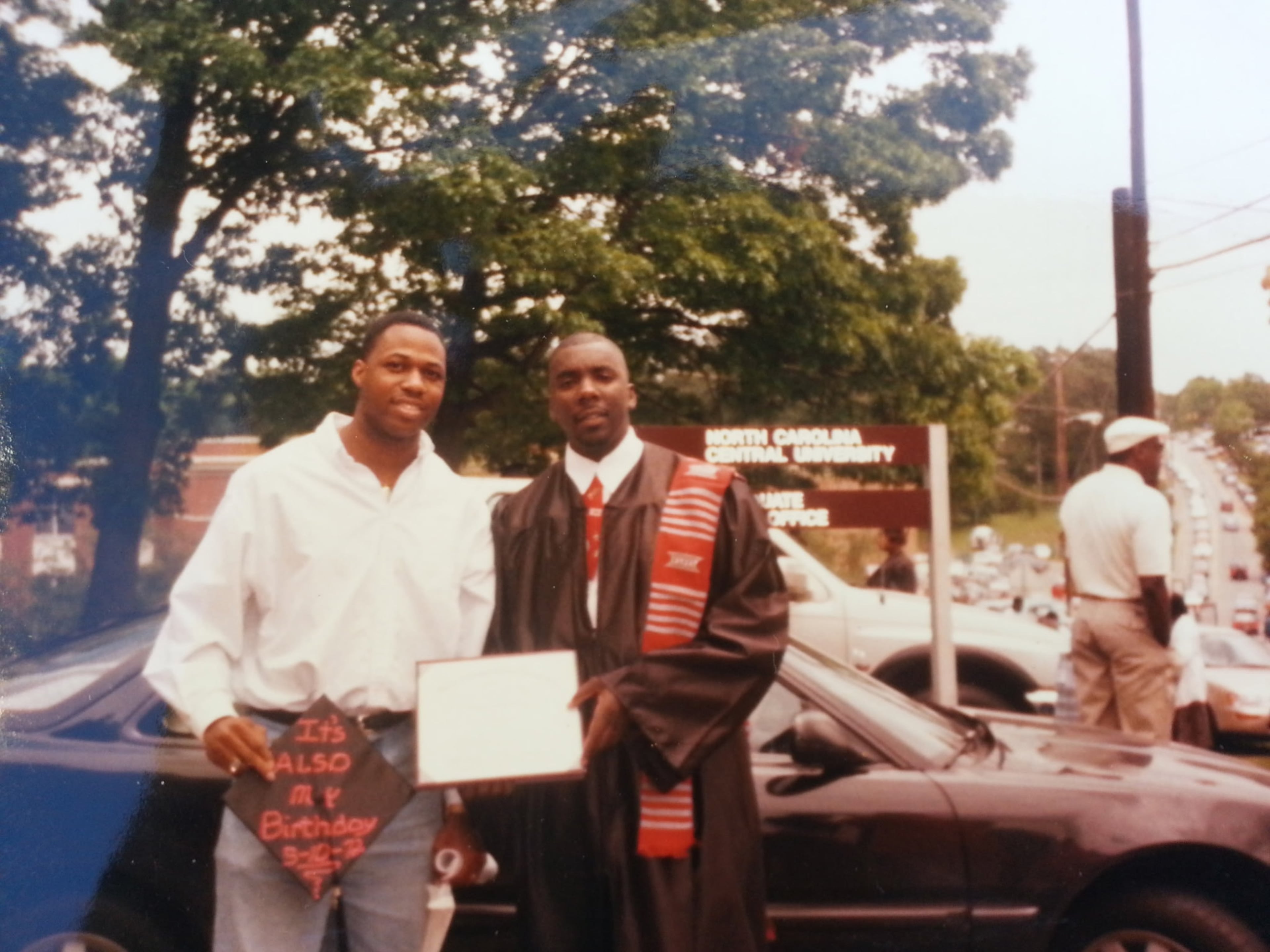 Michael Bailey (right), immediately after his 1997 graduation from North Carolina Central University. He now serves as NCCU's executive director of undergraduate admissions. (Michael Bailey).