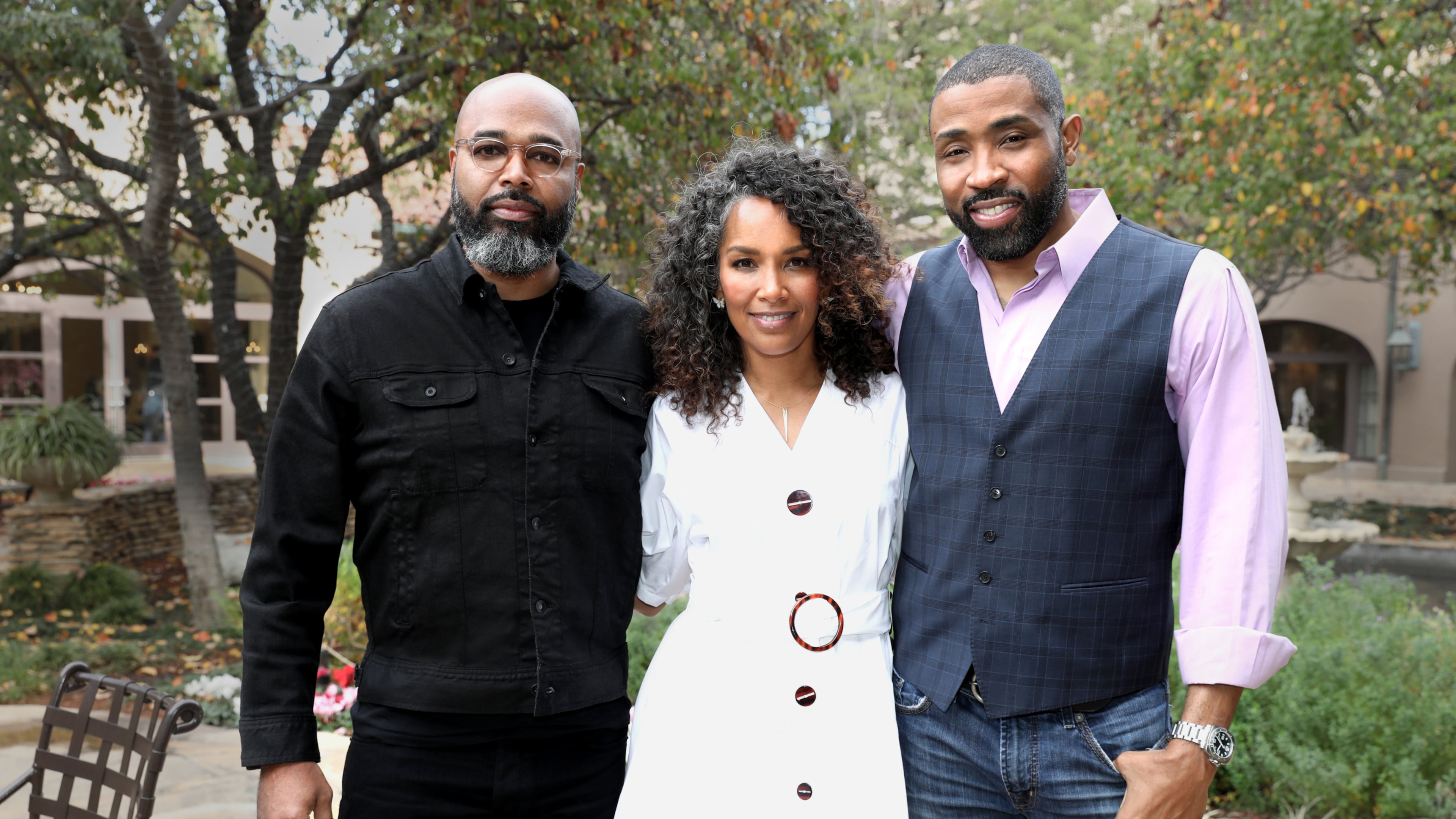 "Black Lightning" executive producer Mara Brock Akil is flanked by executive producer and husband Salim Akil (left) and actor Cress Williams at the CW's TCA panel in 2018. After a successful TV career, Akil is releasing her debut novel. (Chris Frawley/The CW)