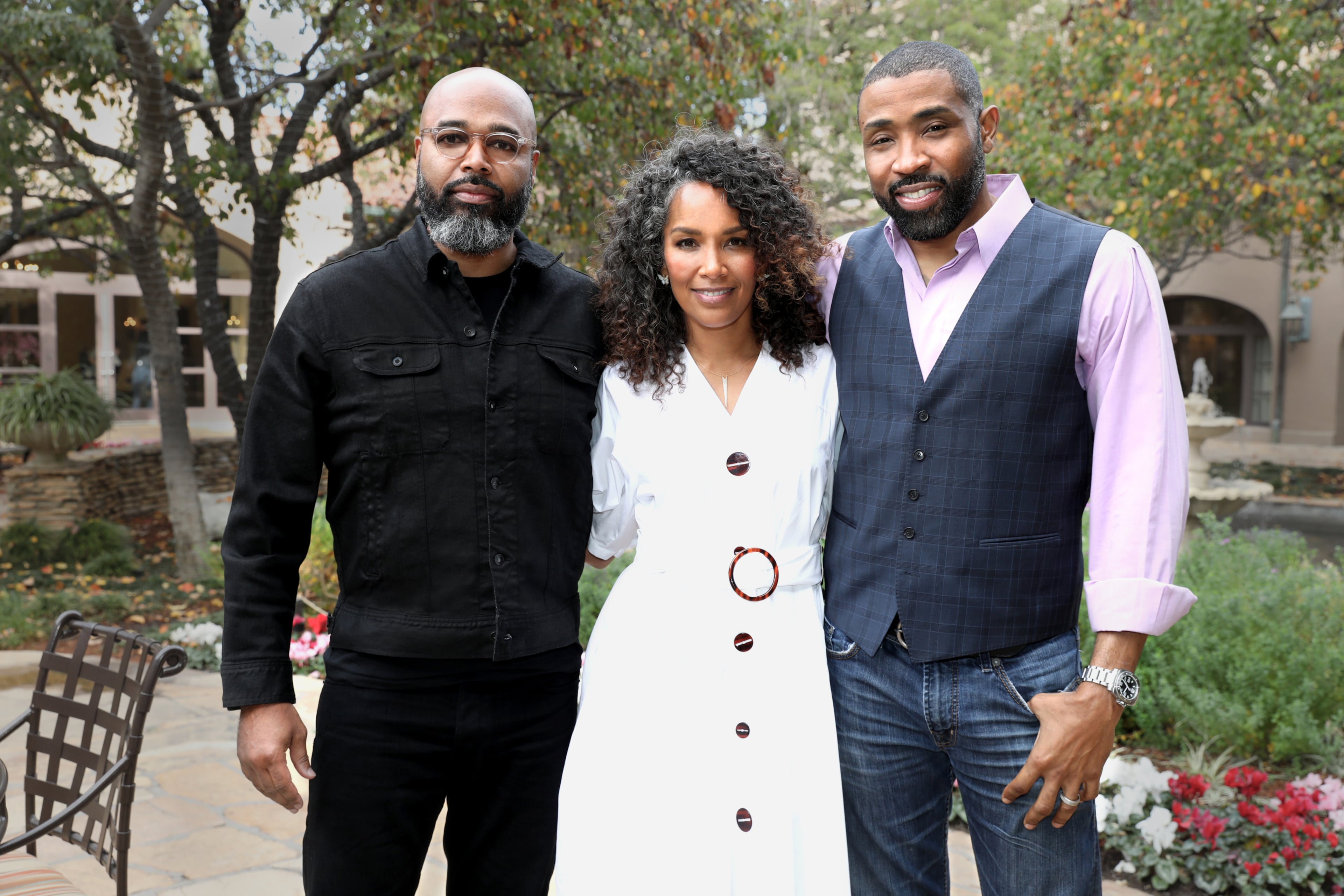 "Black Lightning" executive producer Mara Brock Akil is flanked by executive producer and husband Salim Akil (left) and actor Cress Williams at the CW's TCA panel in 2018. After a successful TV career, Akil is releasing her debut novel. (Chris Frawley/The CW)