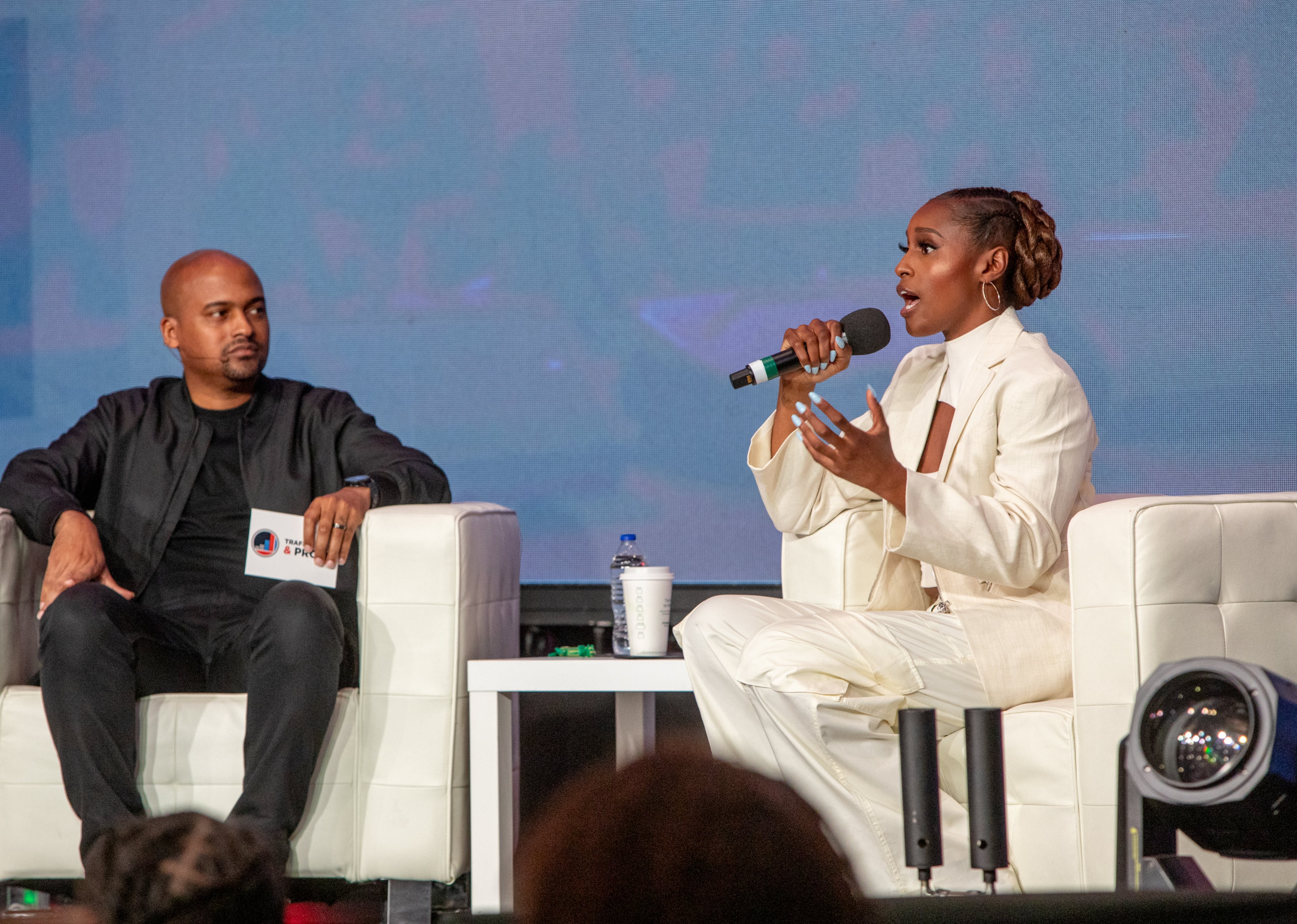 Lamar Tyler (left) — pictured speaking to Issa Rae at Traffic Sales and Profit's conference in 2023 — co-founded TSP in Atlanta in 2015 to help other entrepreneurs. (Jenni Girtman for the AJC 2023)