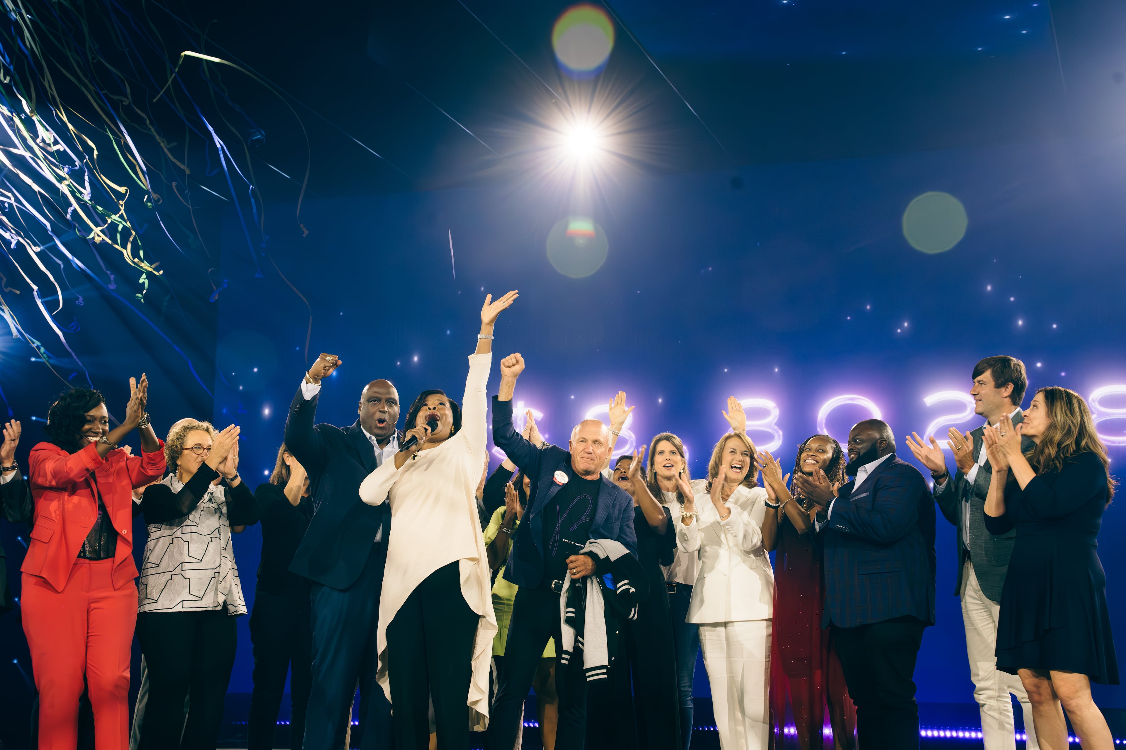 The Same House supporters celebrate as they announce that the 2023 Beloved Benefit raised $8.8 million for charity. (Olivia Bowdoin for the AJC 2023).
