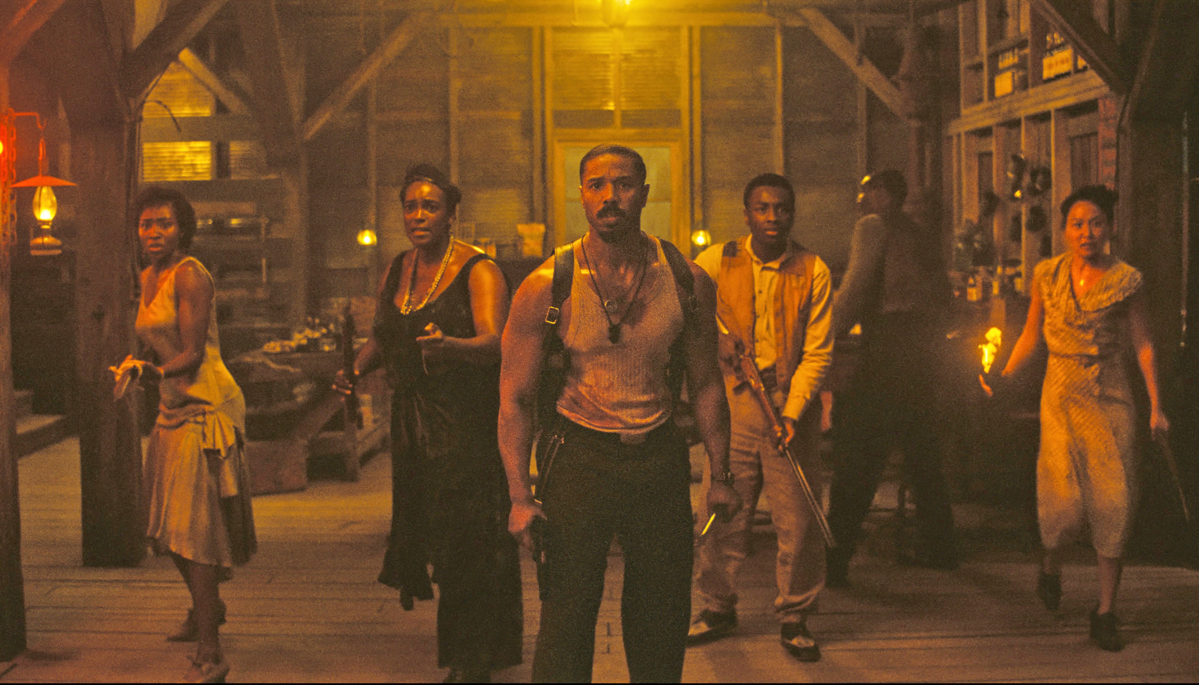 This image released by Warner Bros Pictures shows Michael B. Jordan, center, in a scene from "Sinners." (Warner Bros. Pictures via AP)