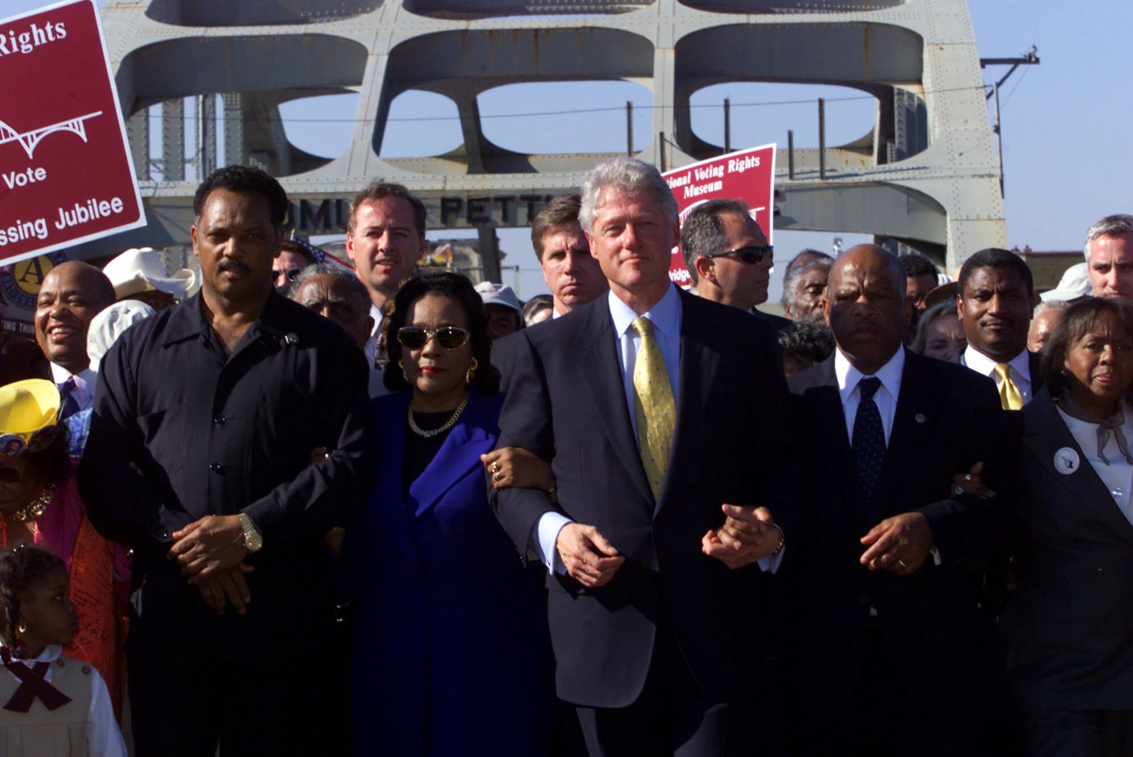 President Bill Clinton (center) leads thousands of marchers across the Edmund Pettus Bridge in Selma, Ala., Sunday, March 5, 2000. The celebration is the 35th anniversary of Bloody Sunday when Alabama state troopers beat marchers when they attempted to cross the bridge in a march to Montgomery seeking voting rights. From left: the Rev. Jesse Jackson, Coretta Scott King, Clinton, U.S. Rep. John Lewis, D-Ga., and his wife Lillian Lewis. (J. Scott Applewhite/AP)