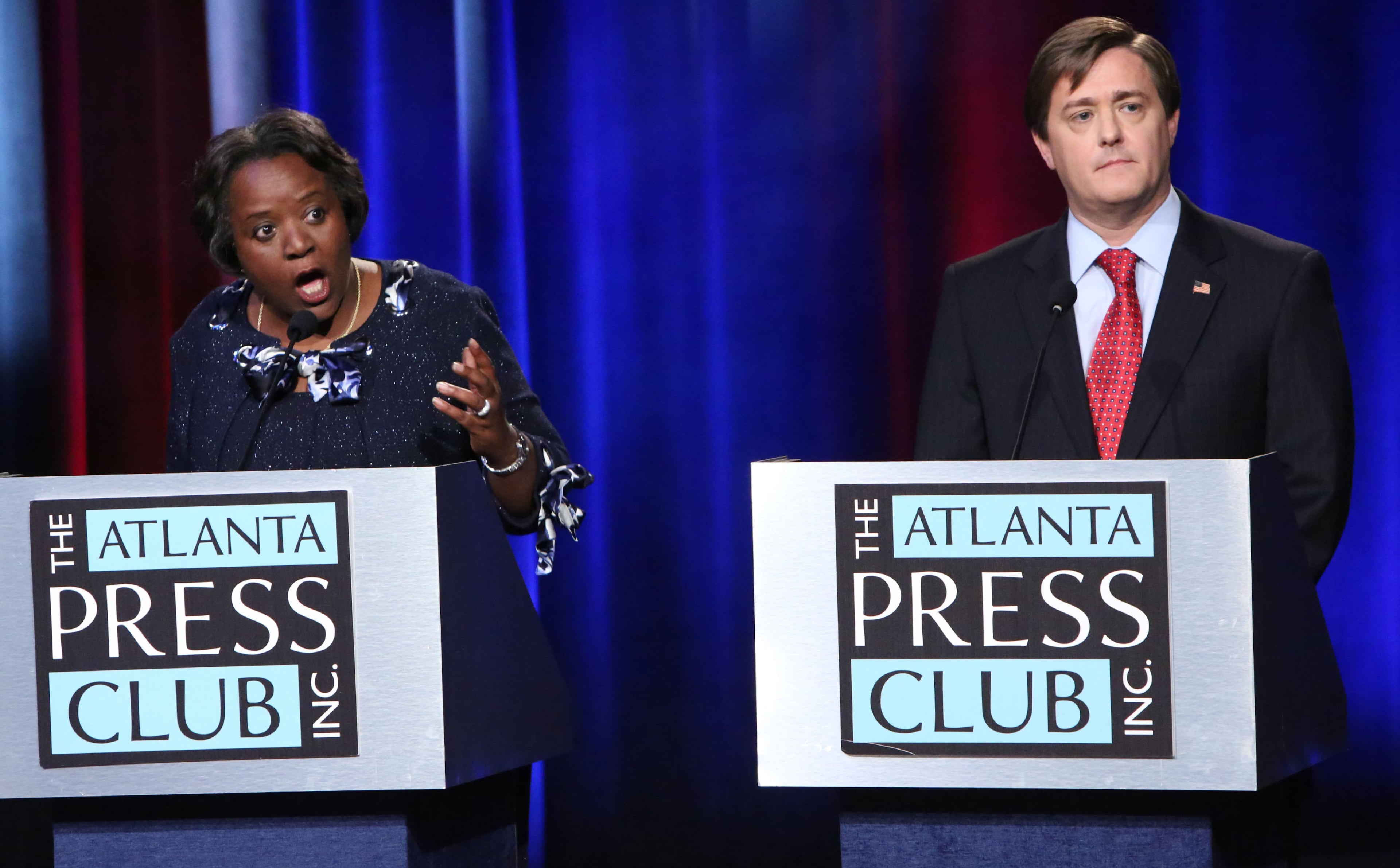 Robbin Shipp, left, and Mark Butler participate in a Atlanta Press Club debate for the State Labor Commissioner in 2014. (Photo by Phil Skinner)