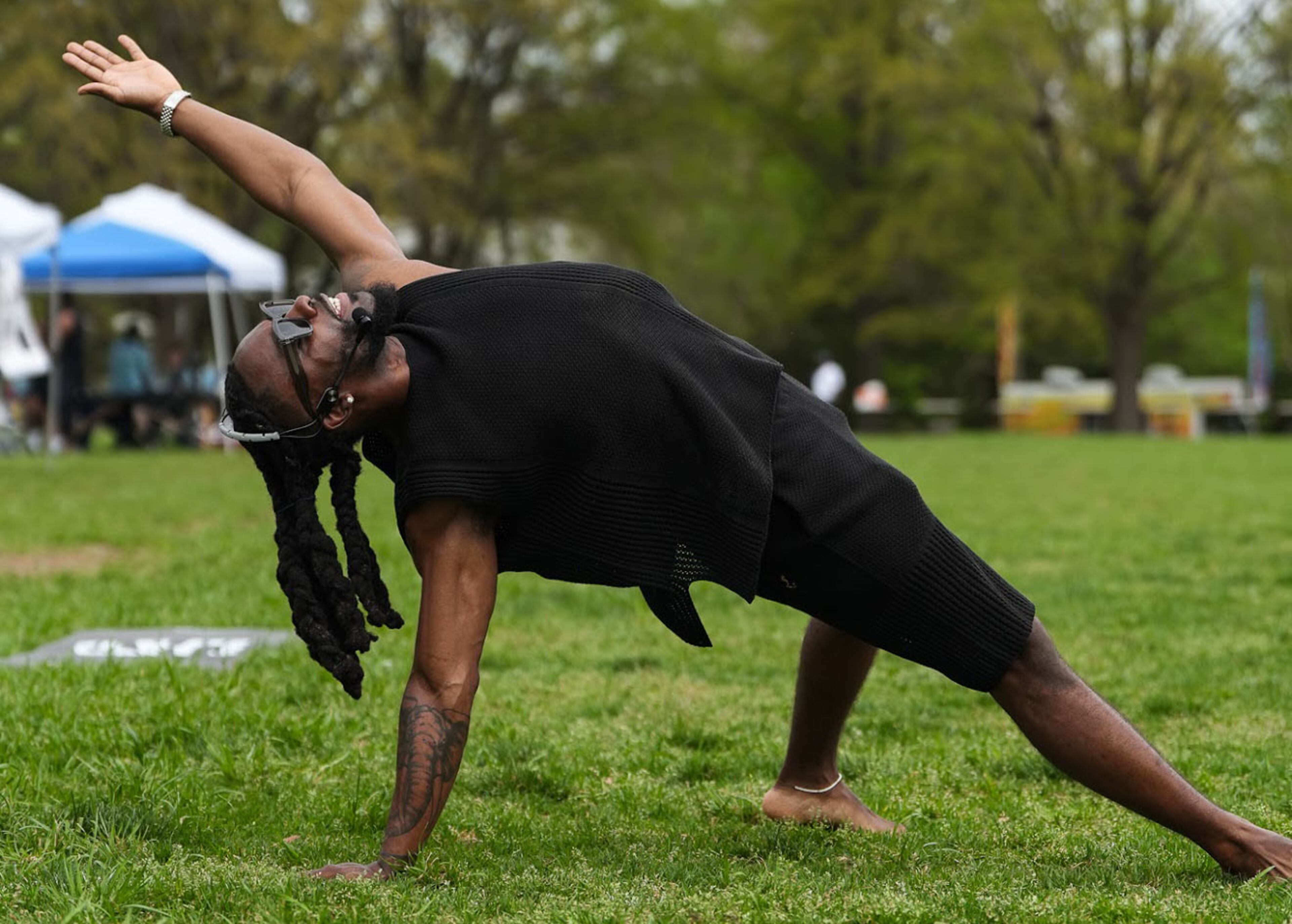 Olu demonstrates a pose at a COMPXSS yoga event. (Courtesy of Olu)