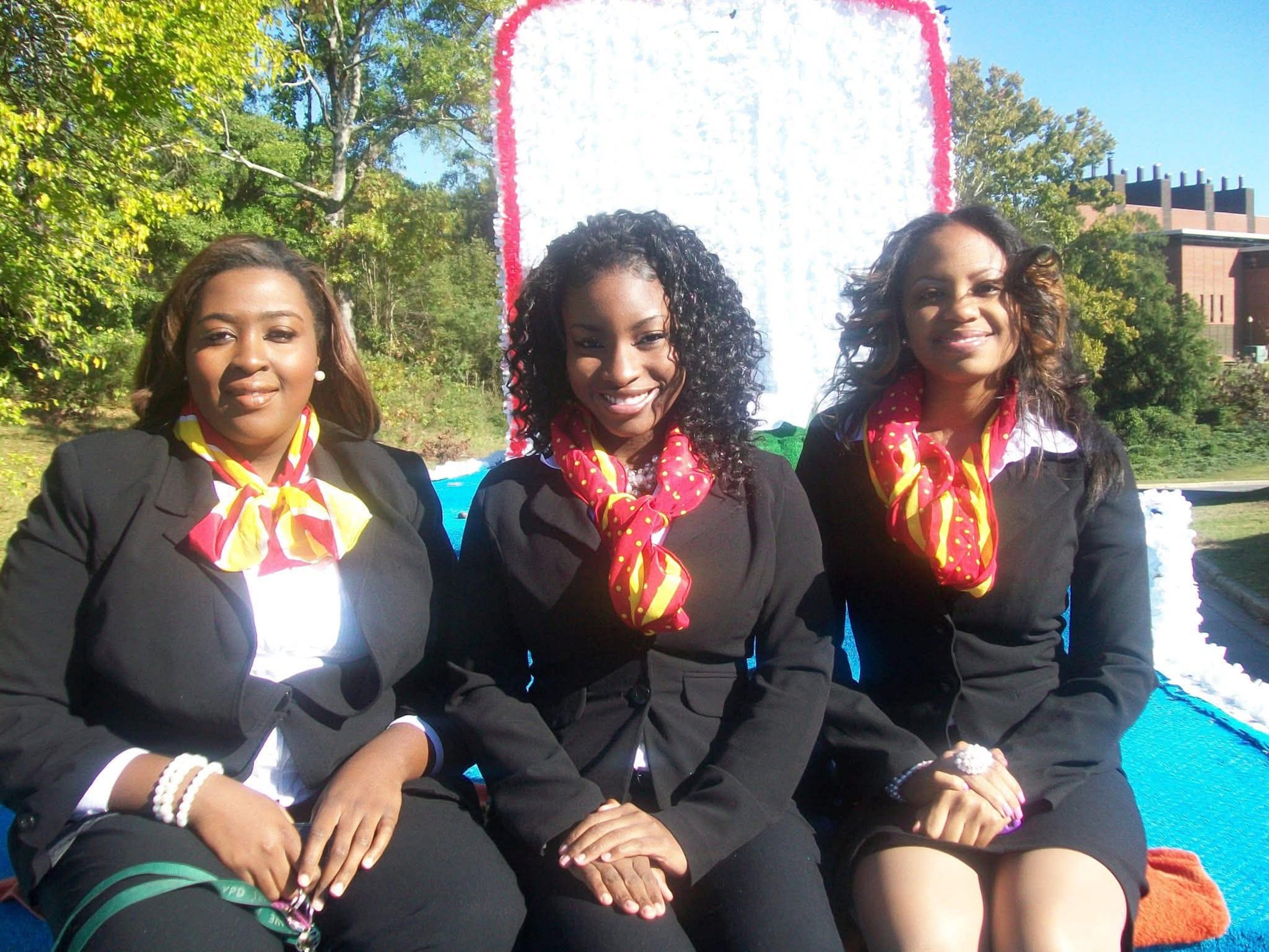 Janita Ferguson (left, then-senior class president), Tuskegee University Class of 2012, poses with two other class officers during homecoming in fall 2010. (Courtesy of Janita Ferguson)