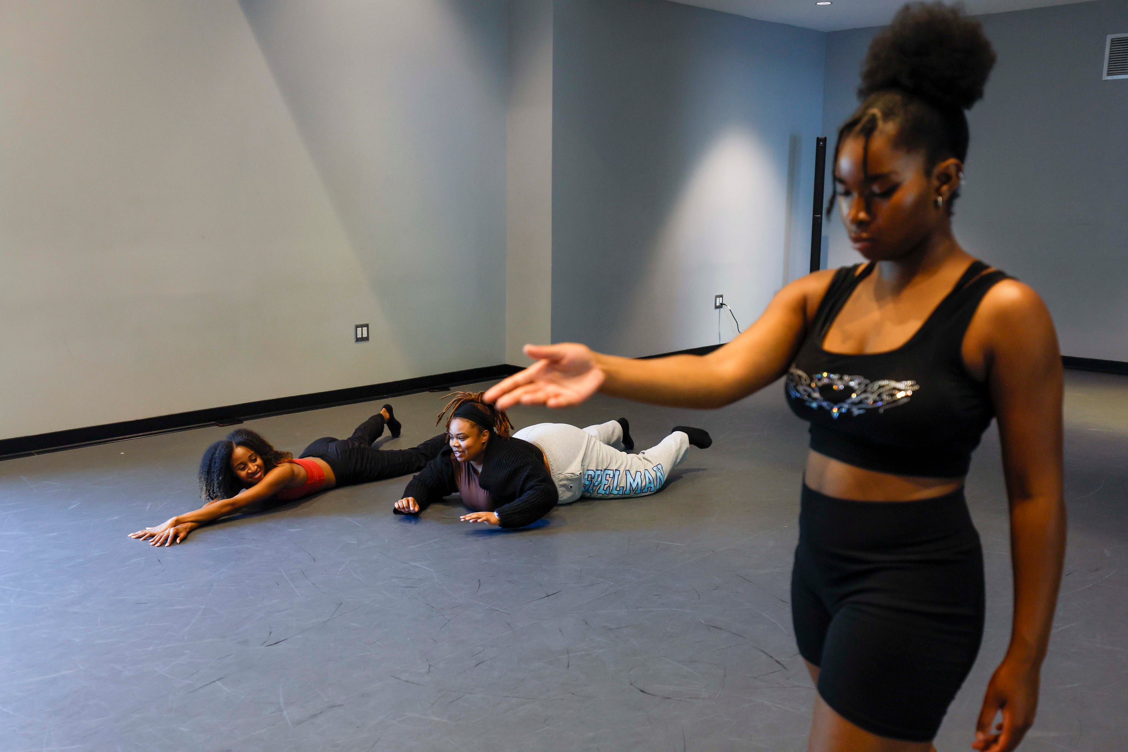 Jamilan Boston, middle, a fellow under choreographer T. Lang, is leading a rehearsal with Spelman College students Zöe Azille, on the right, and Zoe Shepard at the Center of Innovation and Arts on Thursday, April 2, 2026. Students from T. Lang’s dance class at Spelman are preparing for a performance inspired by a’driane nieves’ artwork “Unbound Narratives” at Atlanta Contemporary, exploring how the visual art connects with Black women. (Miguel Martinez/AJC)