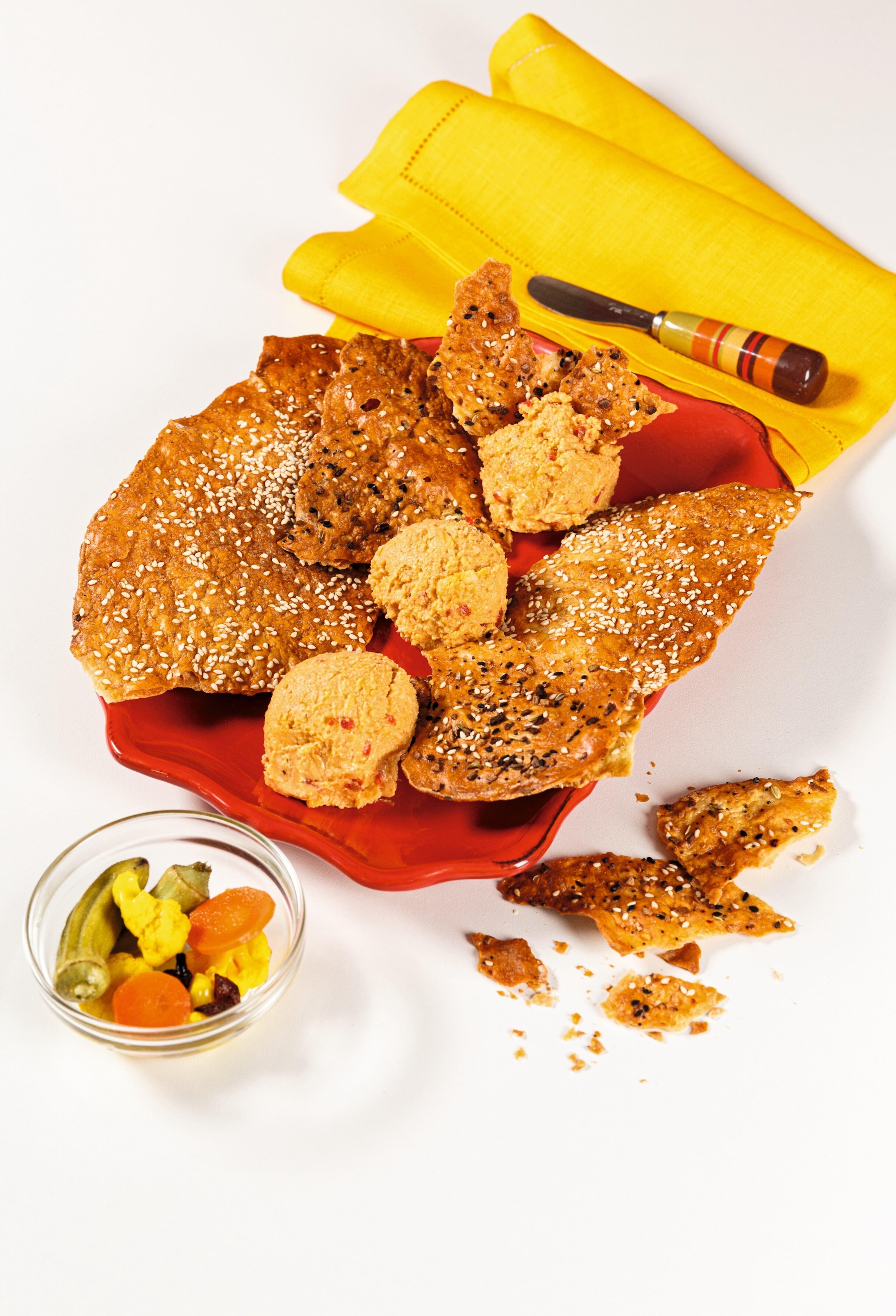 At Southern National, Duane Nutter’s Pimento Cheese is served on a platter with pickled vegetables and sesame flatbread crackers. (Deborah Whitlaw Llewellyn/Courtesy of Gibbs Smith Books)