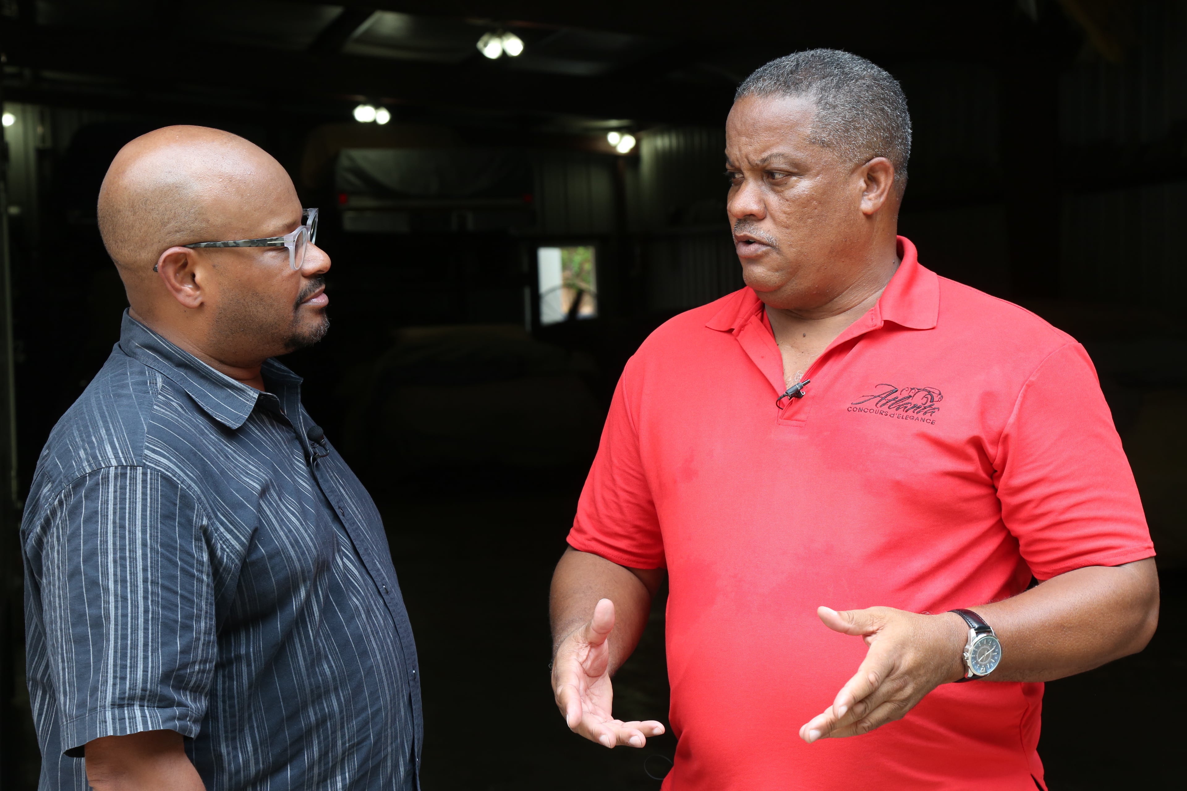 Todd Duncan with the AJC talked in 2019 with Aaron Spaulding (right), an adviser for the Atlanta Concours d'Elegance. (Tyson Horne/AJC)