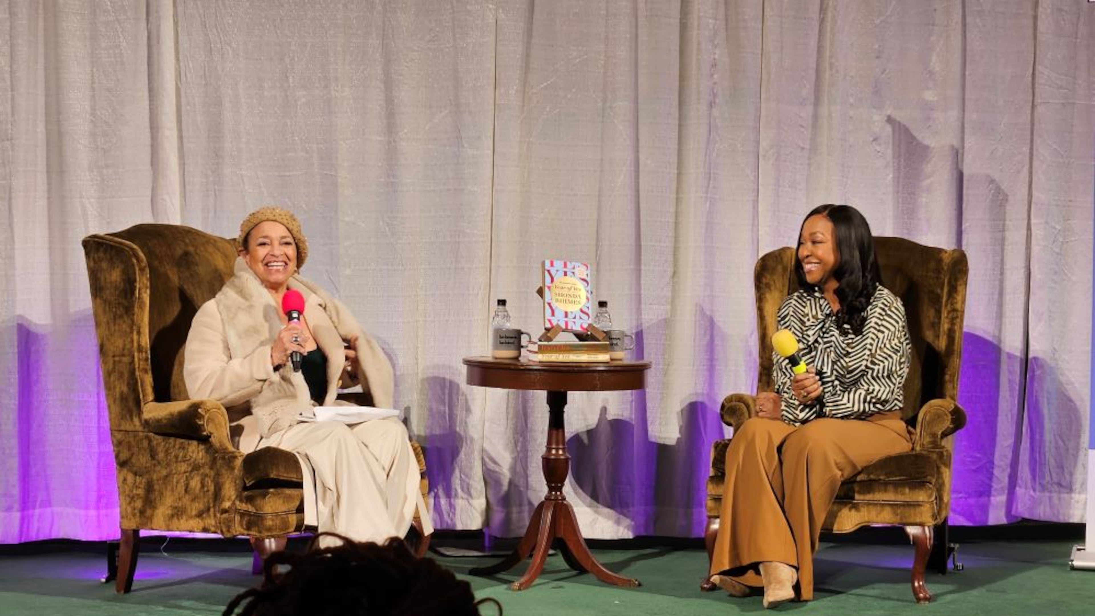 Television writer and executive producer Shonda Rhimes (right) is joined onstage by choreographer and director Debbie Allen (left) for the 10th anniversary 'Year of Yes' book tour at First Baptist Church of Decatur on Thursday, Oct. 23, 2025. (Christopher A. Daniel/AJC)