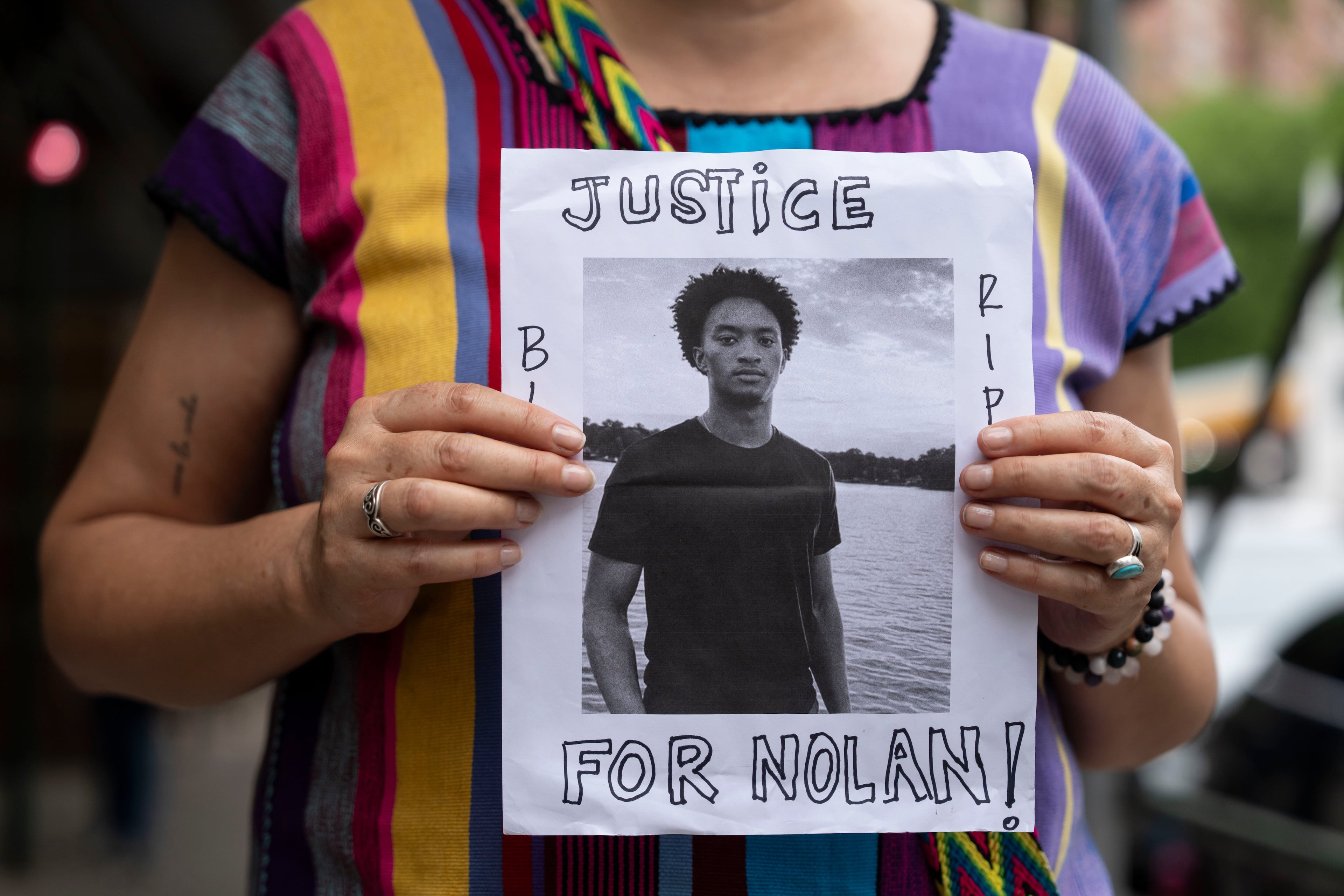 A person holds a picture of Nolan Xavier Wells during a news conference at National Action Network headquarters, Friday, July 10, 2026, in New York. (Yuki Iwamura/AP)