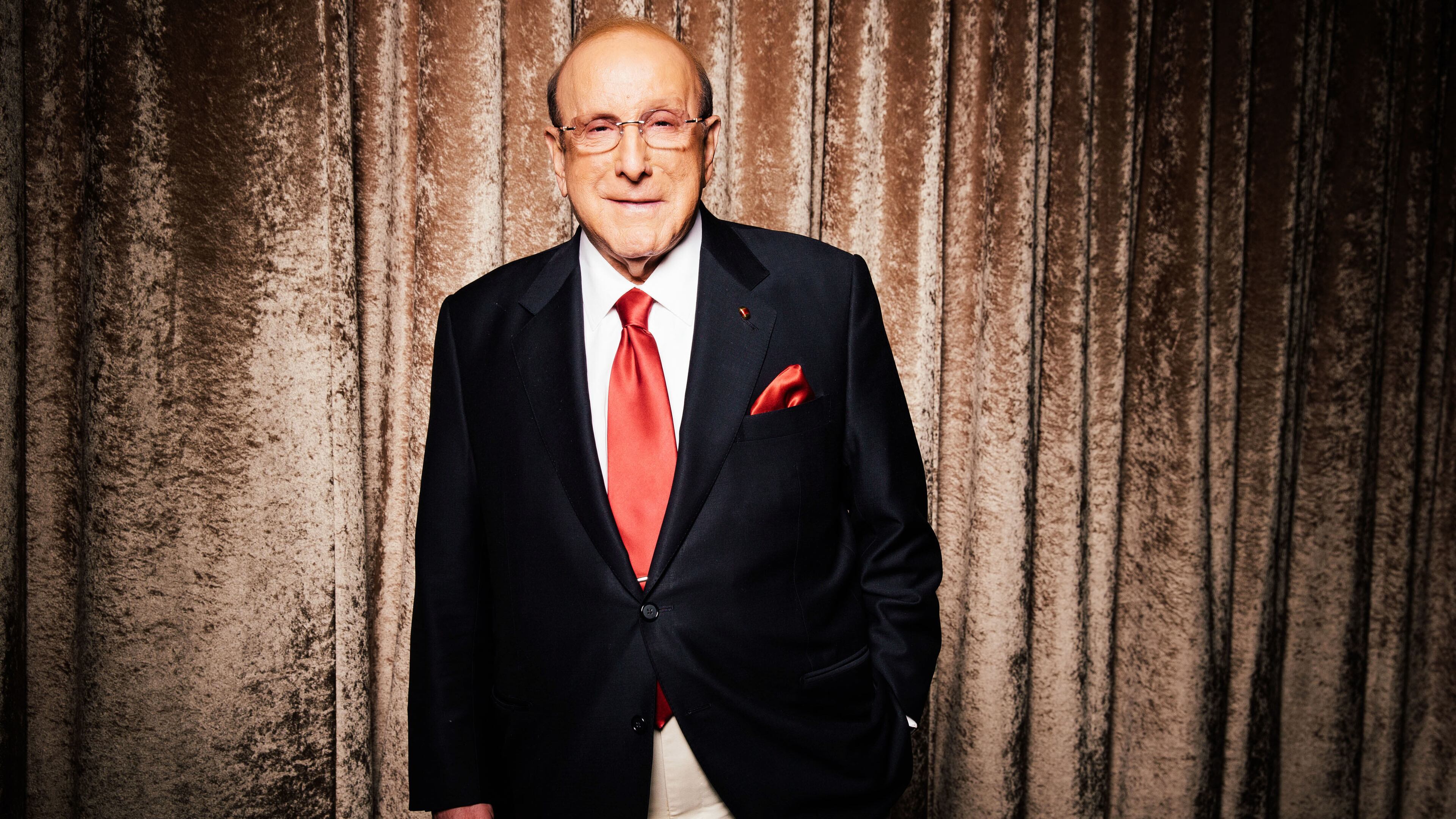 Legendary record executive Clive Davis — pictured during a press day for the Grammys in 2014 — died Monday at age 94. He was inducted into the Rock & Roll Hall of Fame in 2000. (Casey Curry/AP 2014)