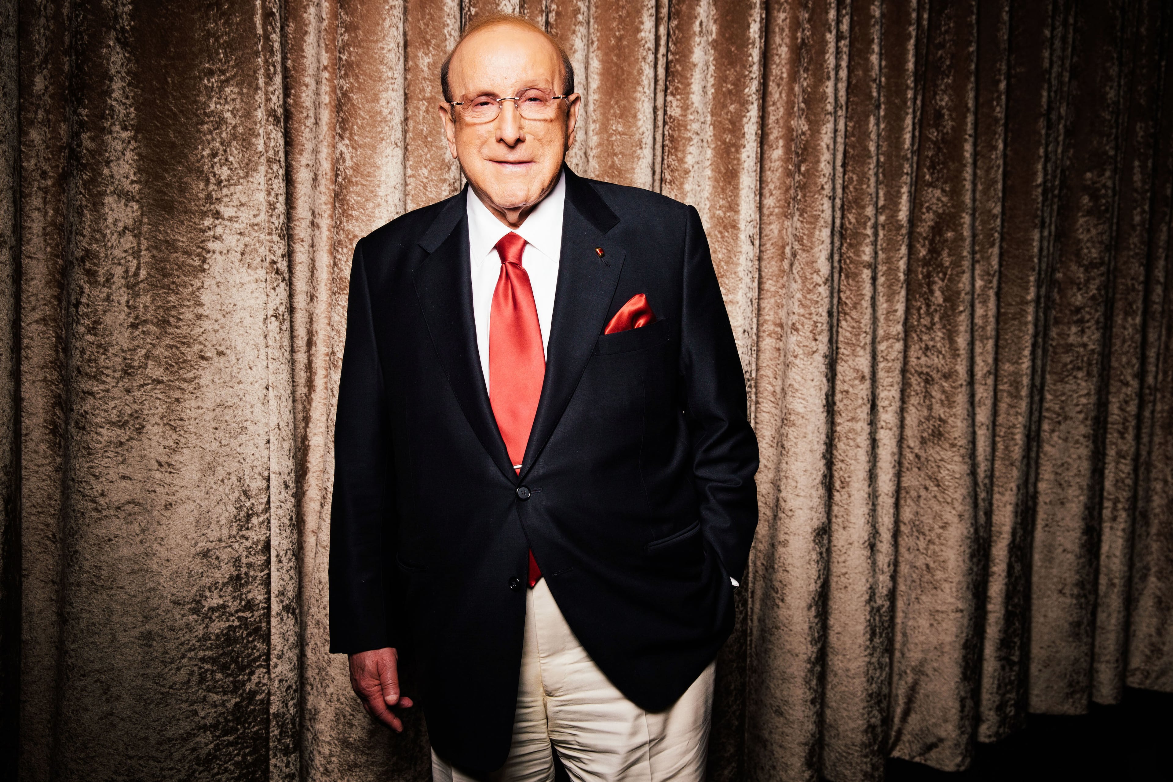 Legendary record executive Clive Davis — pictured during a press day for the Grammys in 2014 — died Monday at age 94. He was inducted into the Rock & Roll Hall of Fame in 2000. (Casey Curry/AP 2014)