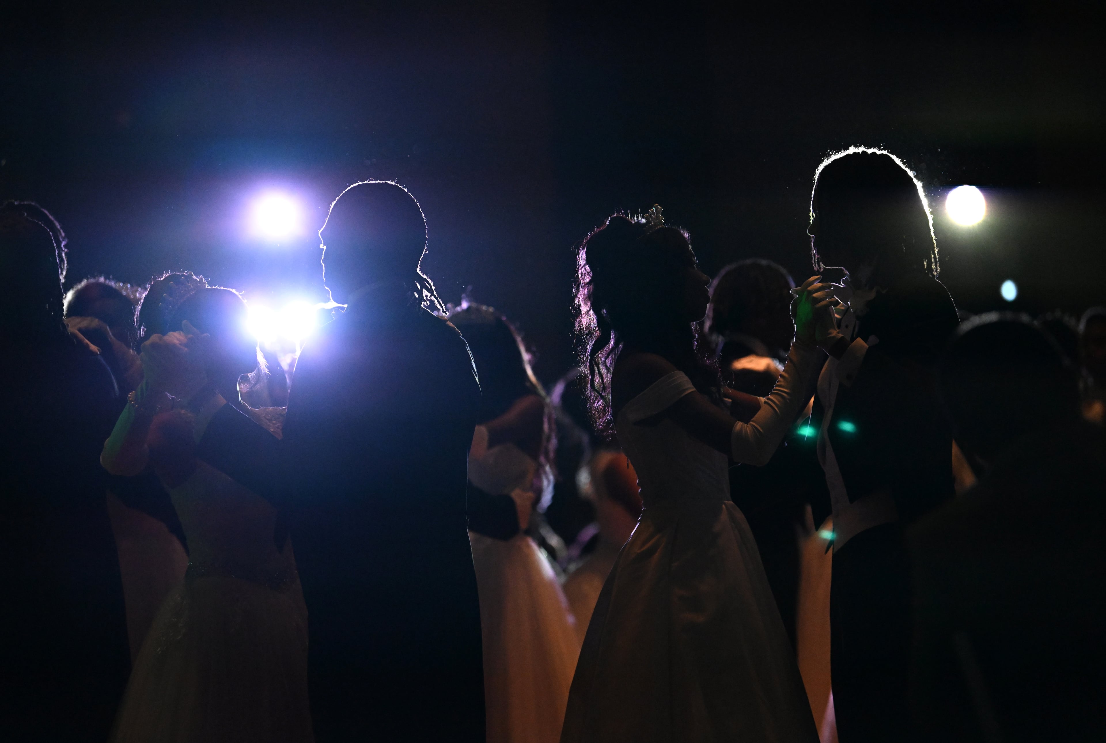 Debutante Yolanda Renee King dances with escort Brandon Coleman (right) during the 2026 Pink Cultured Pearls Cotillion. (Hyosub Shin/AJC)