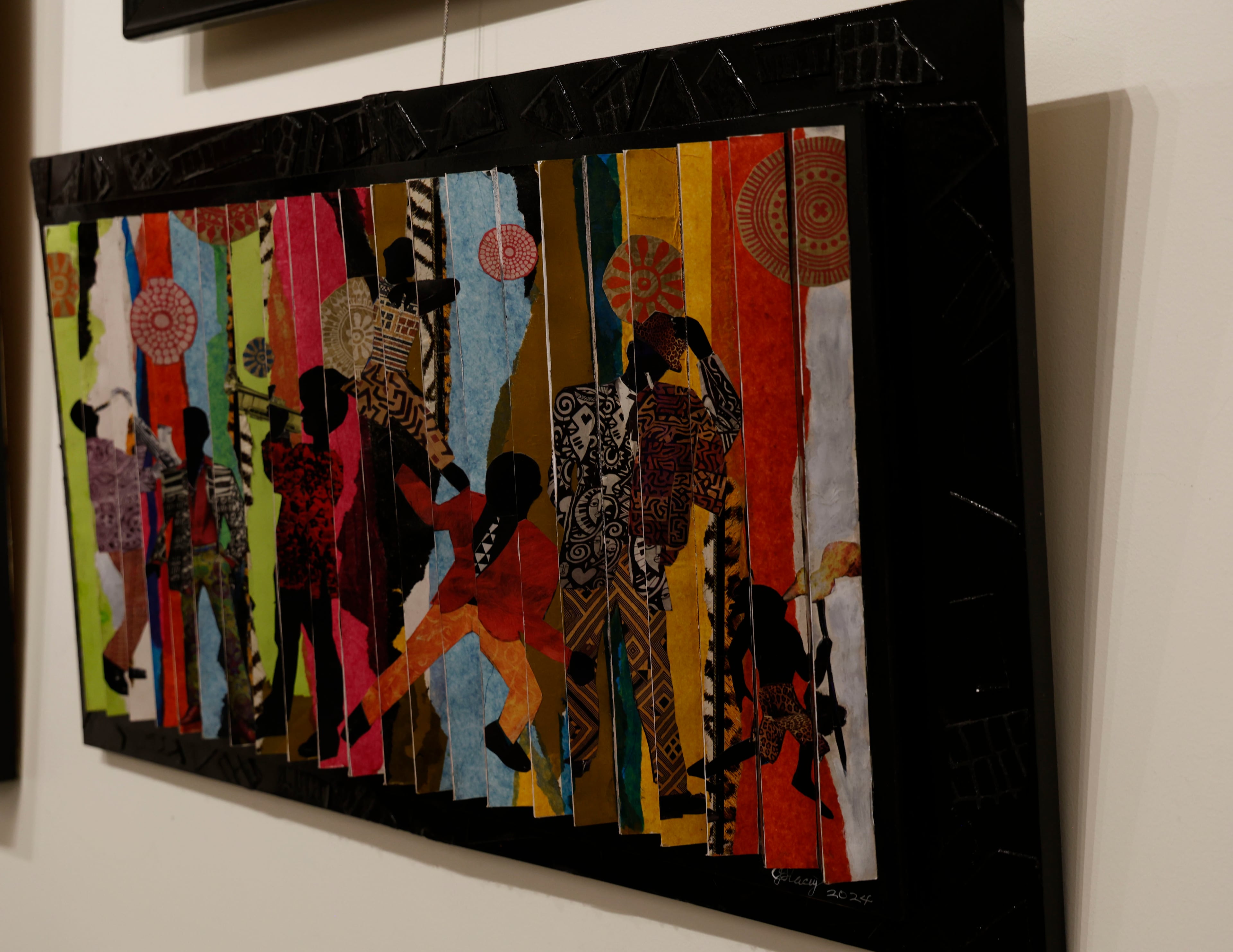 “Genesis to Revelations,” is one of two views of an artistic art expression called an agamorgraph, an art form that seems employ motion, is a part of opening reception of artist J. Stacey Grayson art exhibition at the Fulton County Central Library. Saturday, November 8, 2025. (Akili-Casundria Ramsess, EyeAkili Media for the AJC)