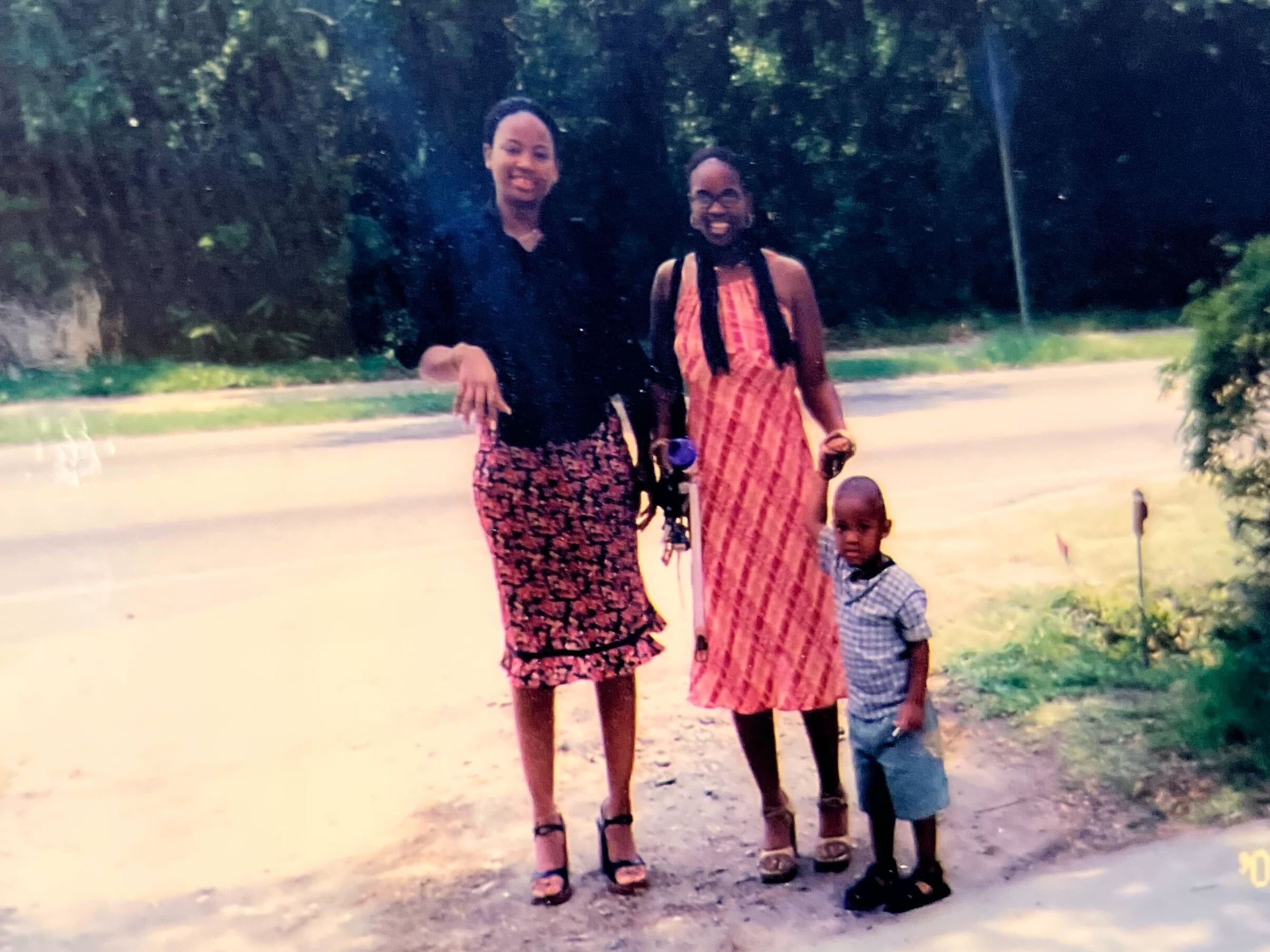 Before he became Quality Lenz, Jaylon Cooper held his mother's hand while they hung out with her best friend. (Courtesy of Quality Lenz)