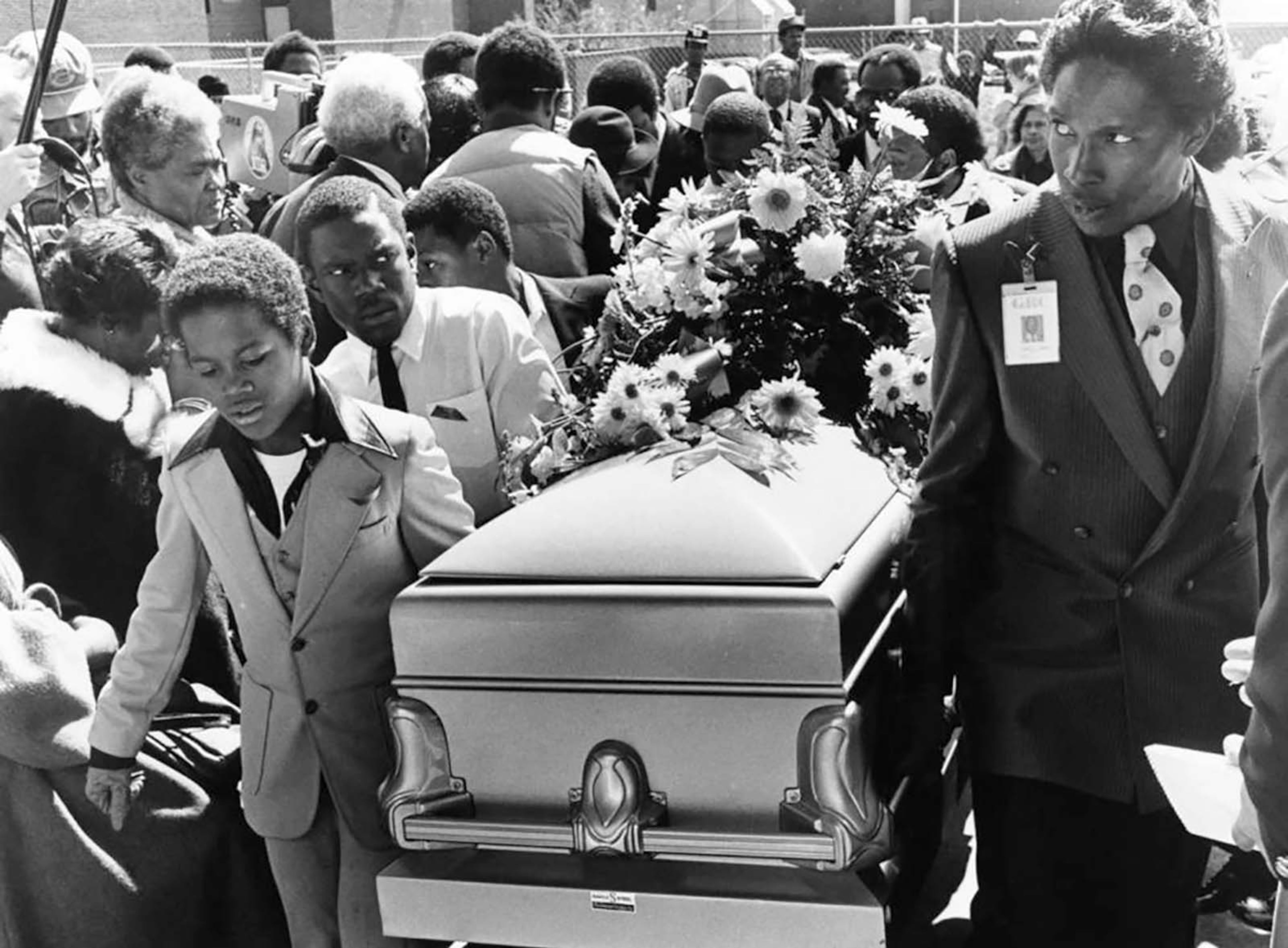 Young pallbearers carry the body of Curtis Walker in the New St. John Baptist Church. (Bill Mahan/AJC file photo)