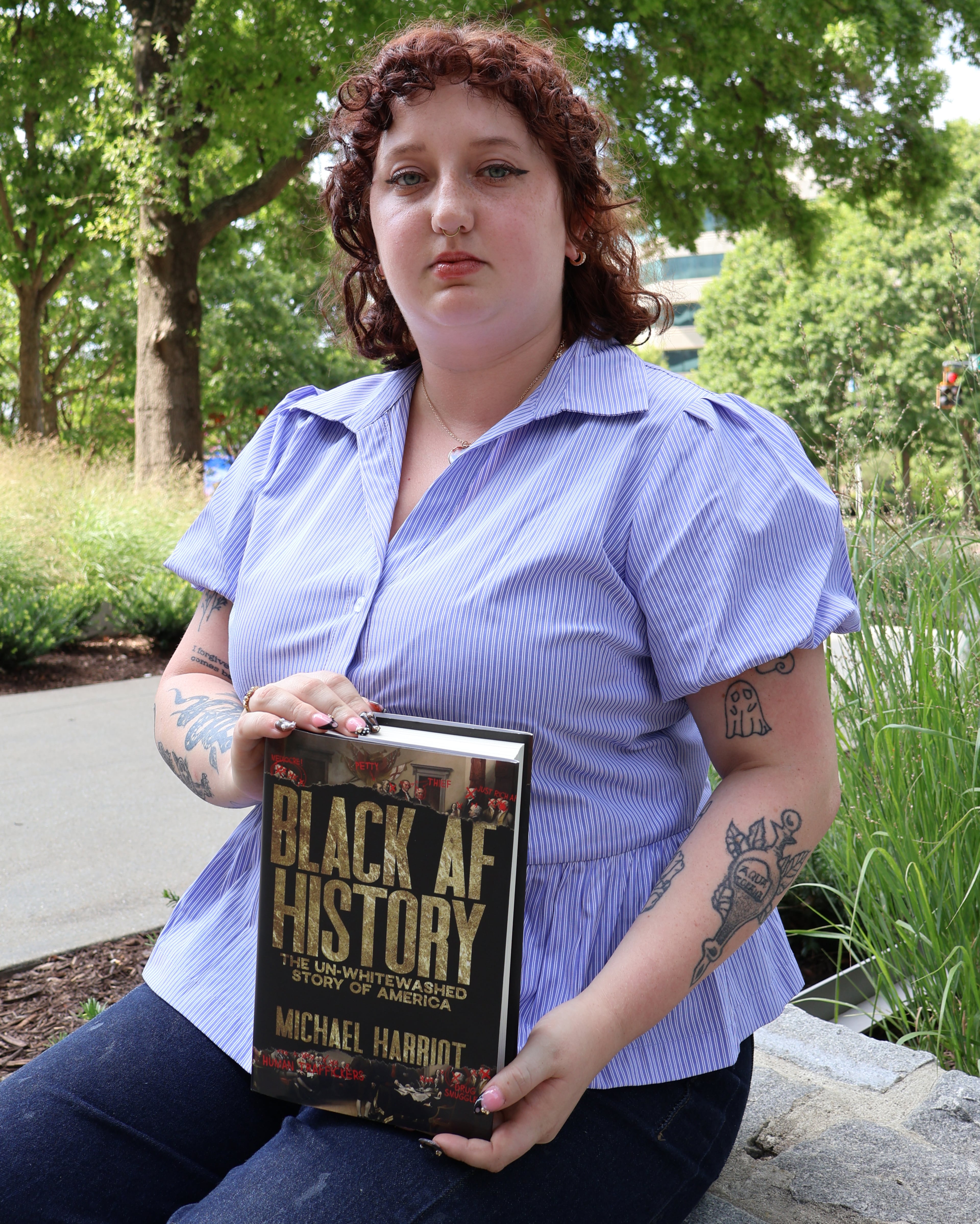 Carson Bonner, a business intern from Berry College, recommends “Black AF History: The Un-Whitewashed Story of America” by Michael Harriot. (Kevin Pernell/AJC)