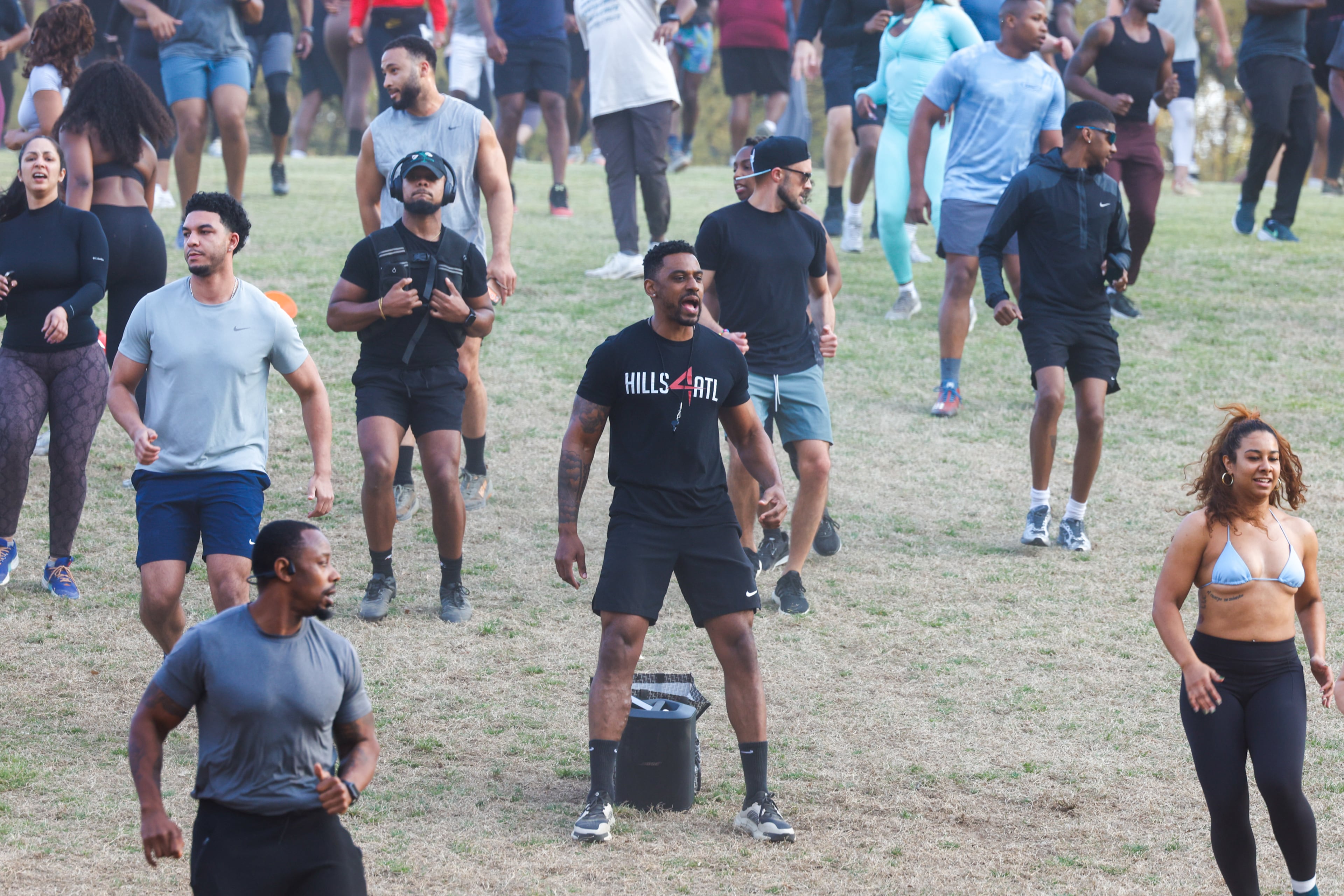 Alvin Bailey (center) leads the Hills4ATL fitness group exercise event at Piedmont Park in Atlanta on Wednesday, March 25, 2026. (Arvin Temkar/AJC)