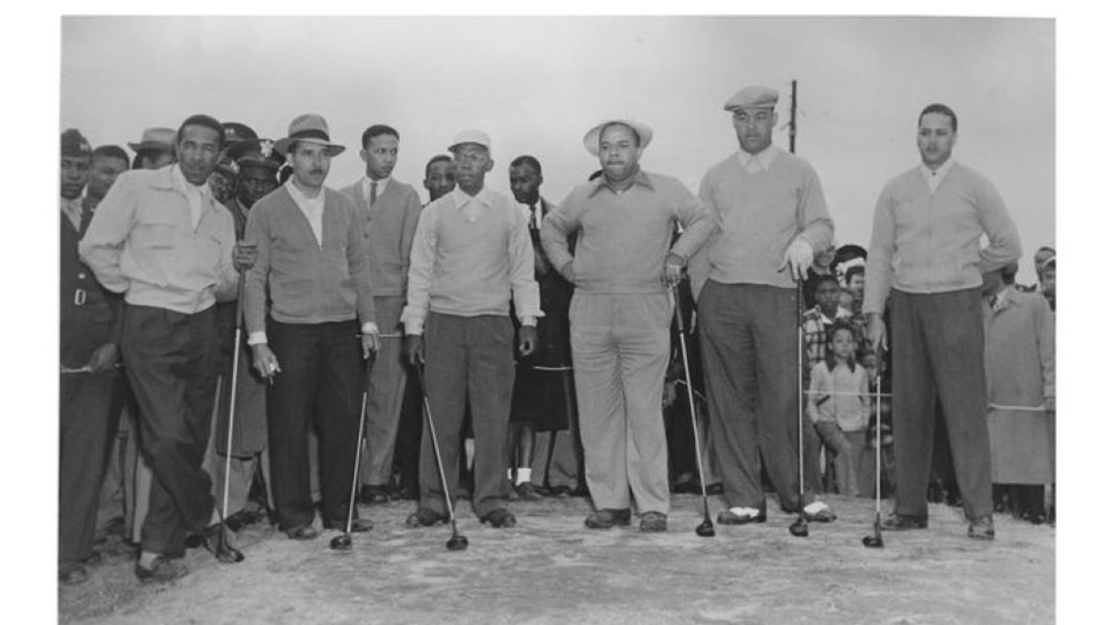 Alfred "Tup" Holmes (center) was an amateur golf champion whose Holmes v. City of Atlanta case in the Supreme Court ended segregation on public golf courses in 1955. He trained athletes, including boxer Joe Louis. (Courtesy of Alfred 'Tup' Holmes Legacy Foundation)
