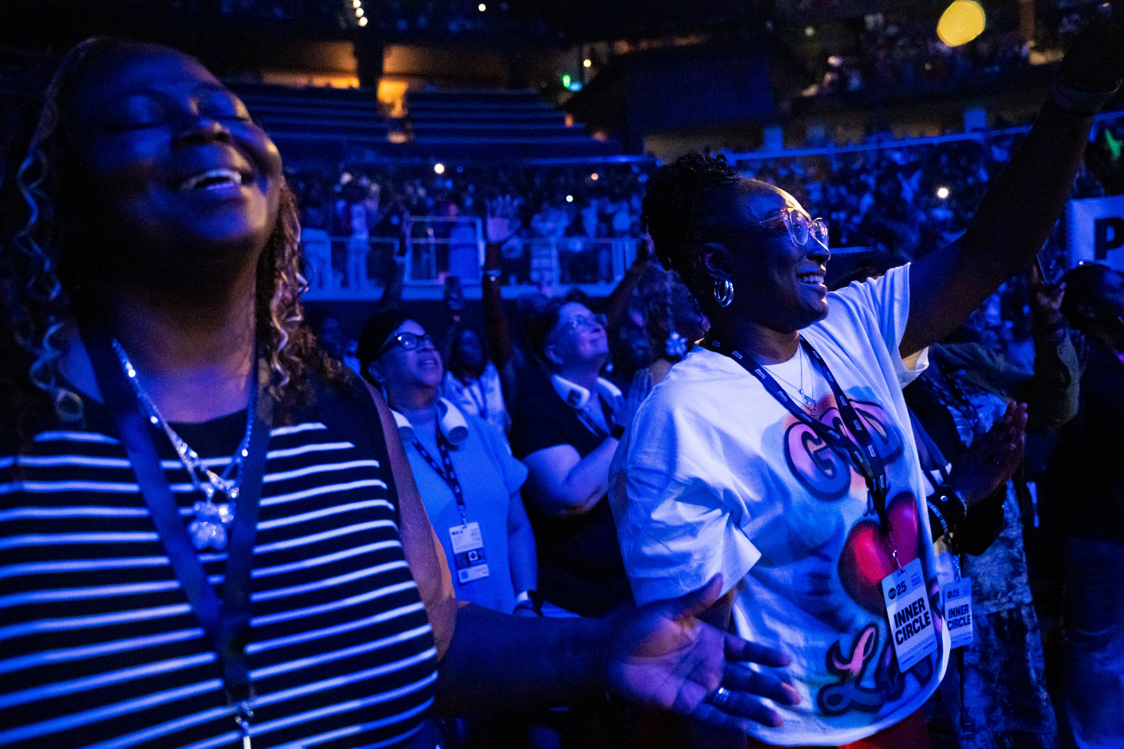Women worship during the Woman Evolve conference, Thursday, Aug. 1, 2025, in Atlanta. (Olivia Bowdoin for the AJC)
