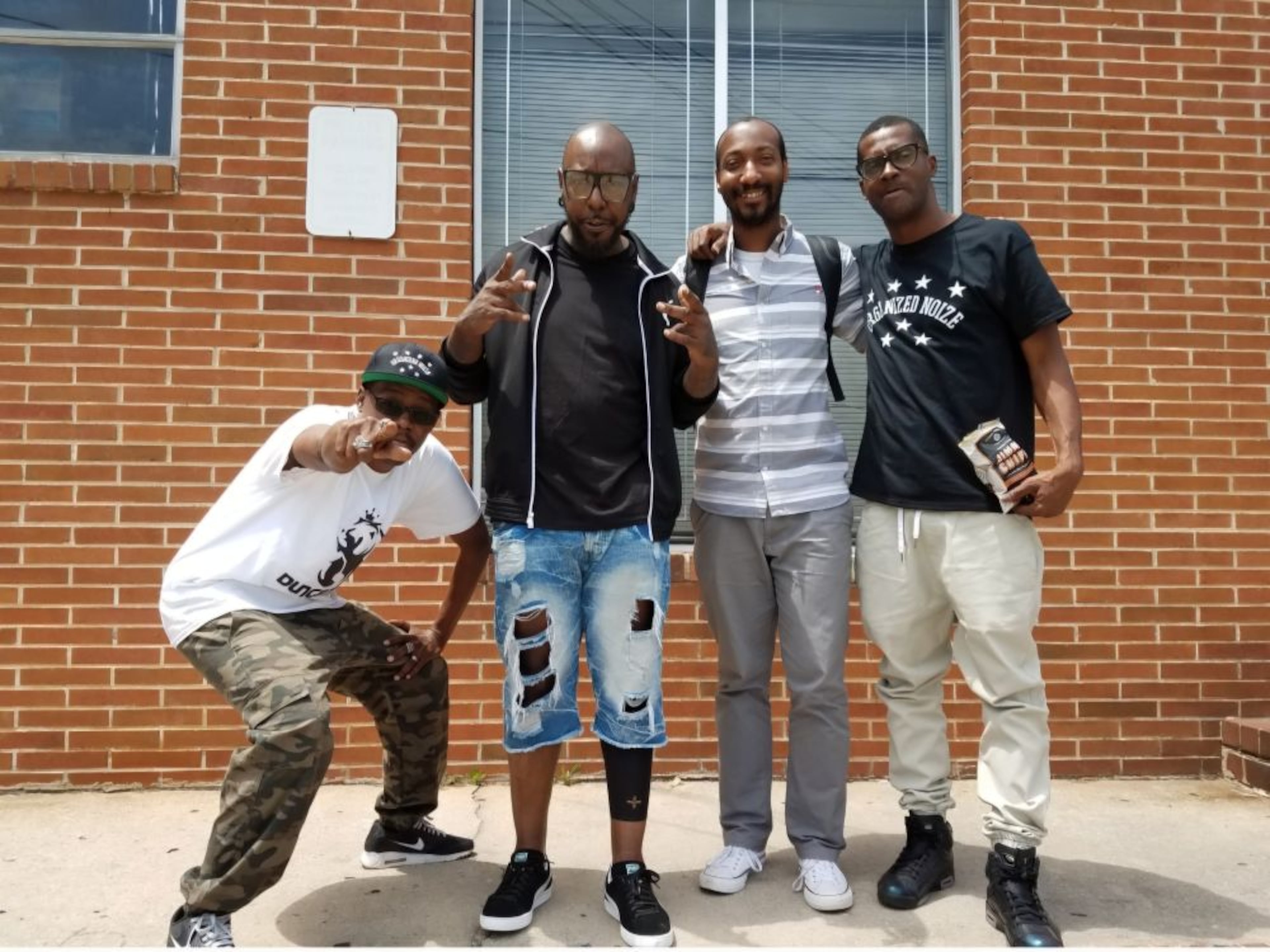 UATL Black culture reporter Christopher A. Daniel (third from left) poses with production trio Organized Noize members (from left) Ray Murray, Patrick "Sleepy" Brown and the late Rico Wade at Stankonia Studios in Atlanta on May 11, 2017. (Courtesy of Christopher A. Daniel).