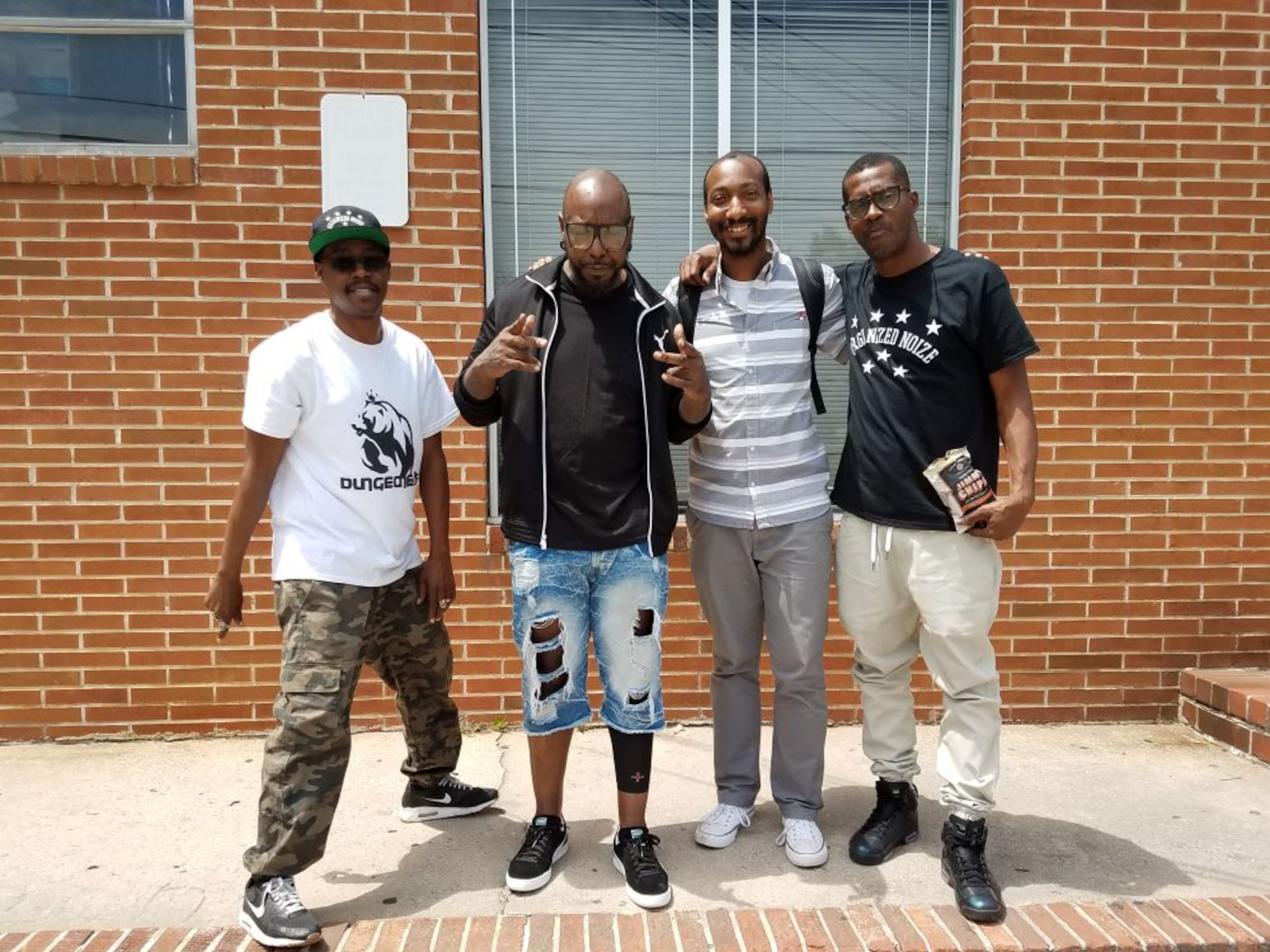 UATL Black culture reporter Christopher A. Daniel poses post-interview with Atlanta production trio Organized Noize members Ray Murray (l.), Patrick 'Sleepy' Brown (c.) and the late Rico Wade (r.) at Stankonia Recording Studios in Atlanta, Georgia, on May 11, 2017. (Courtesy of Juanita Stephens)