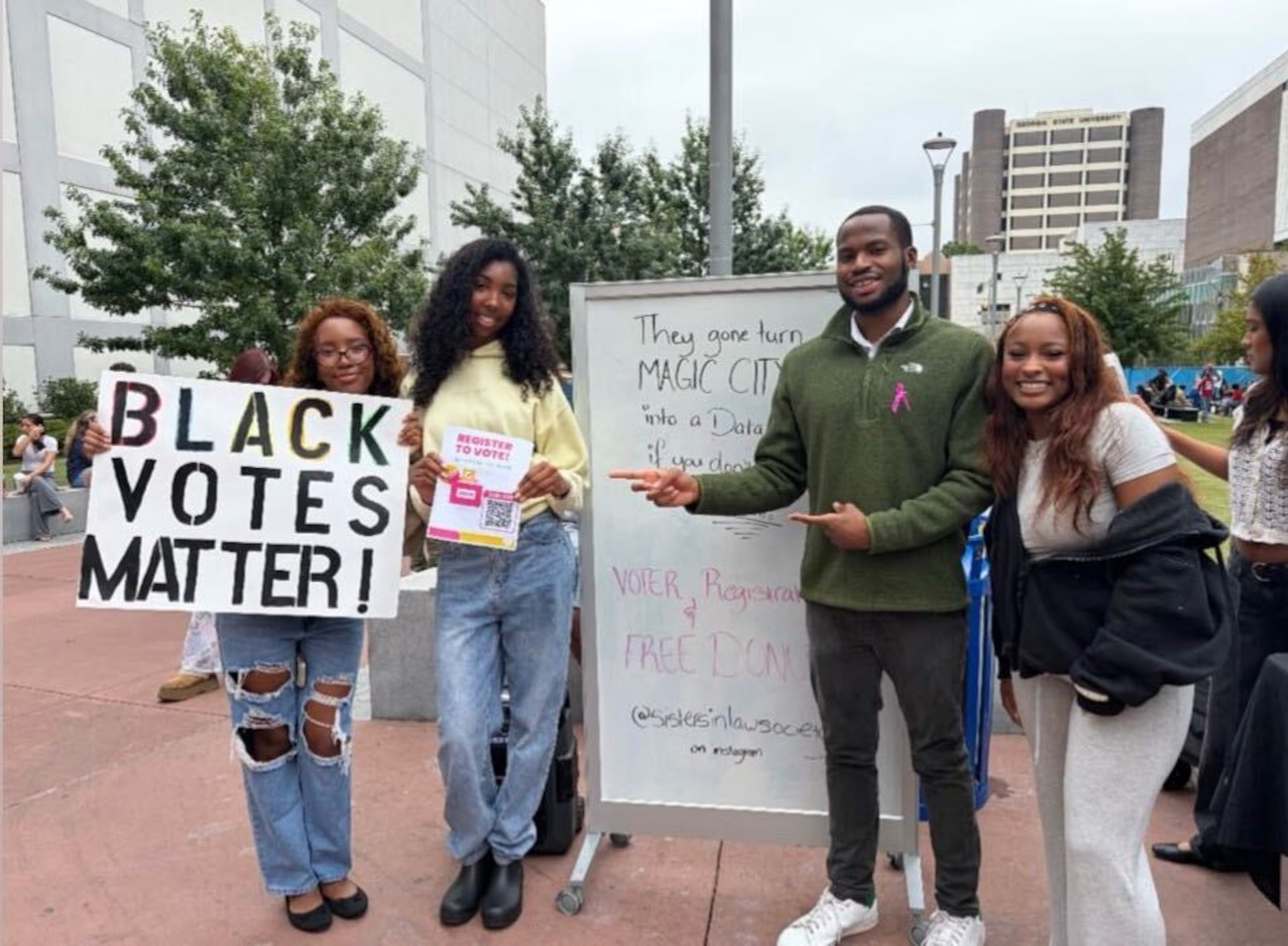 Georgia State University student Brazil Gibbs participates in the Sisters in Law Society's voter registration booth on Oct. 5, 2026. From L to R: Sisters in Law Society Vice President Ila Rose Robinson, Sisters in Law Society Event Coordinator Jordym Murray, Georgia State Rep. Bryce Berry and Sisters in Law Society President Brazil Gibbs. (Courtesy of Brazil Gibbs)