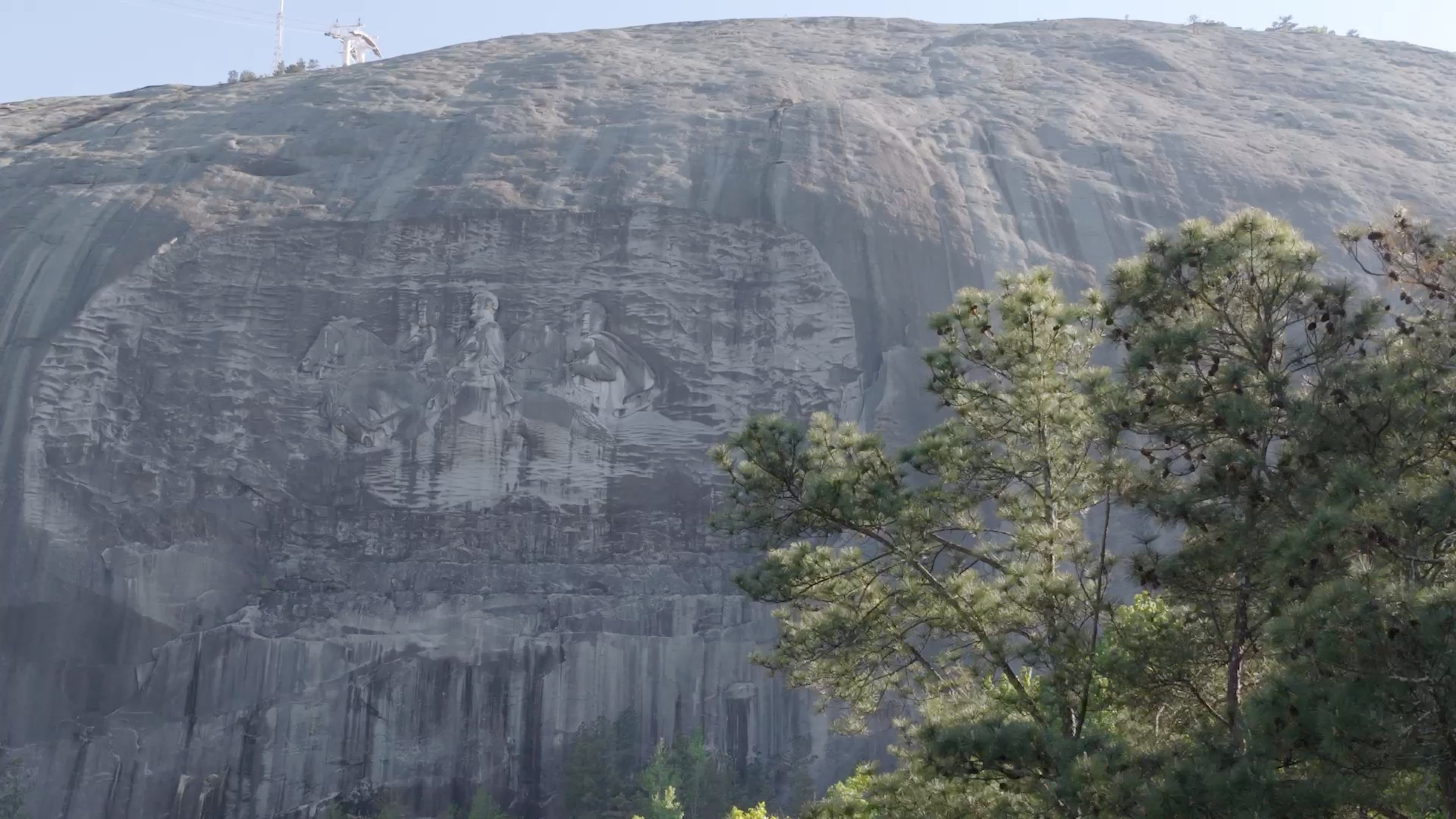 Although some people see Stone Mountain as a celebration of the Confederacy, others view it only as a depiction of history. (Stephen Mucci/AJC)