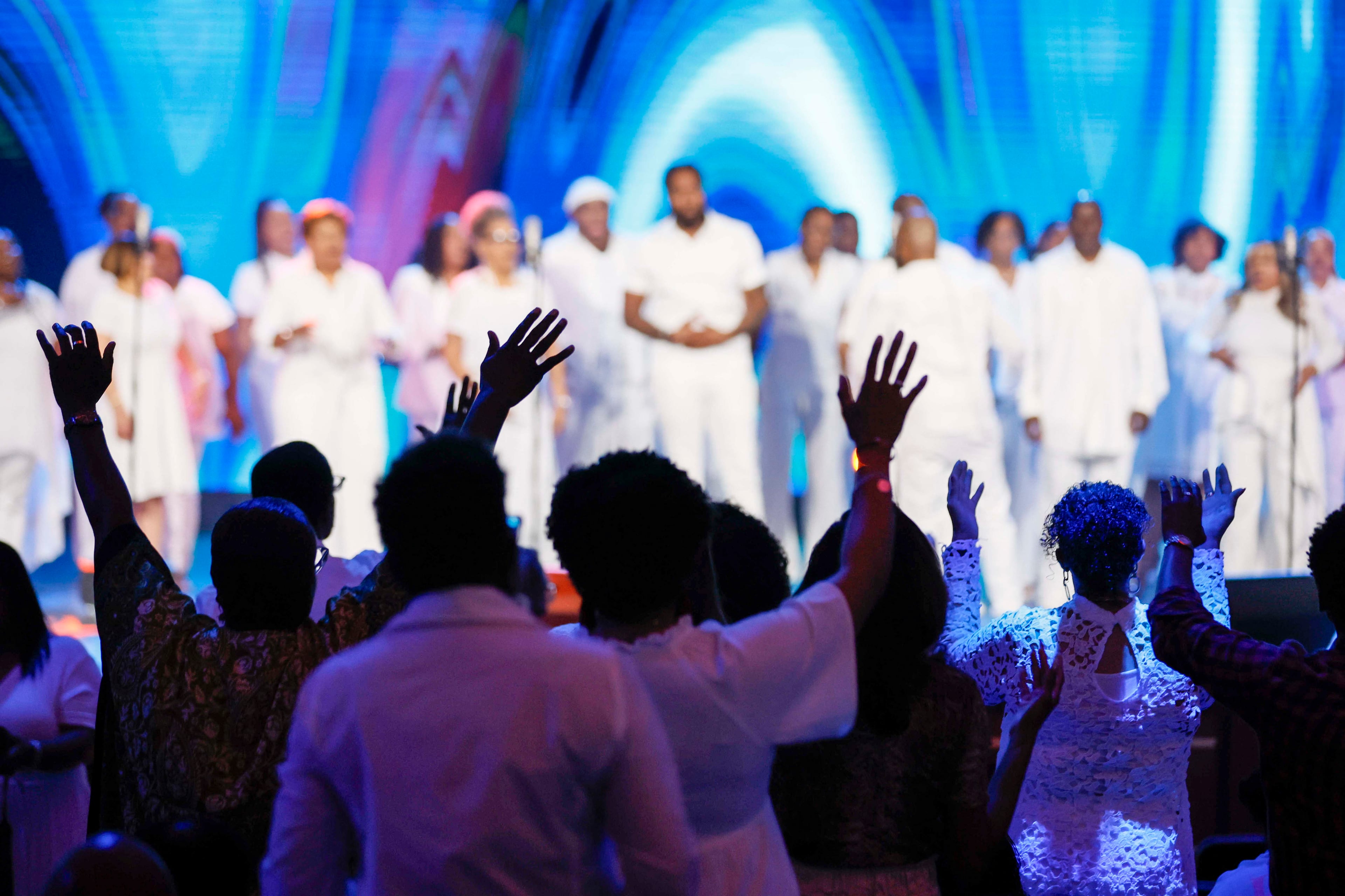 Parishioners sing along with the choir during the 30th pastoral anniversary of Bishop Craig Oliver Sr. at Elizabeth Baptist Church on Sunday, June 8, 2025. (Miguel Martinez/AJC)