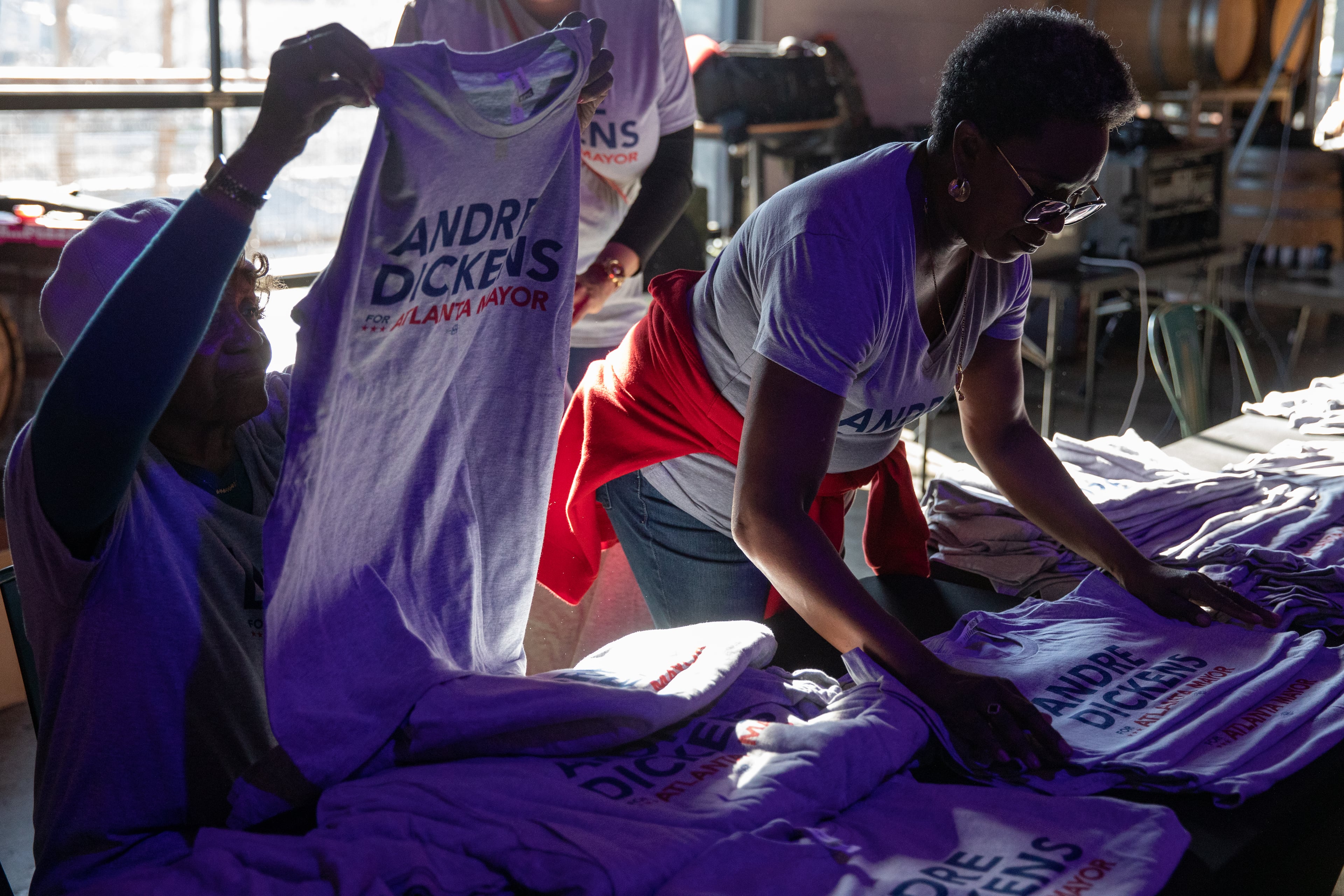 Volunteers for Atlanta Mayor Andre Dickens' reelection campaign hand out T-shirts at his launch party at Monday Night Brewing in the historic West End on March 11, 2025. (Riley Bunch/AJC)