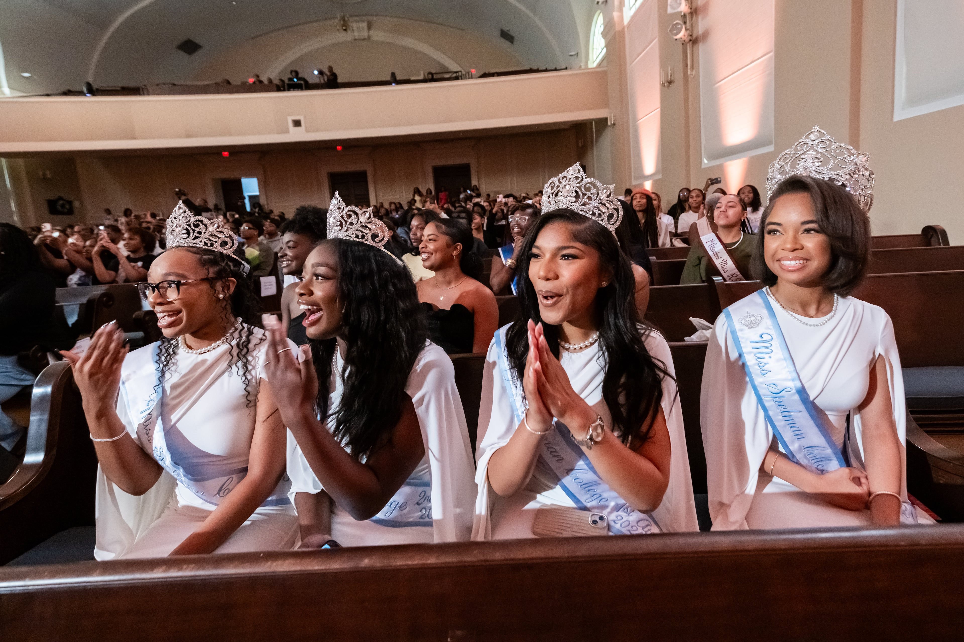 Miss Spelman pageant winners for 2024 (from left) third attendant Arianna Woods, second attendant Josefina Osei-Owusu, first attendant Sanaa Rowser and Miss Spellman Mallory Butts cheer for the 2025 contestants. (Bita Honarvar for the AJC 2025)