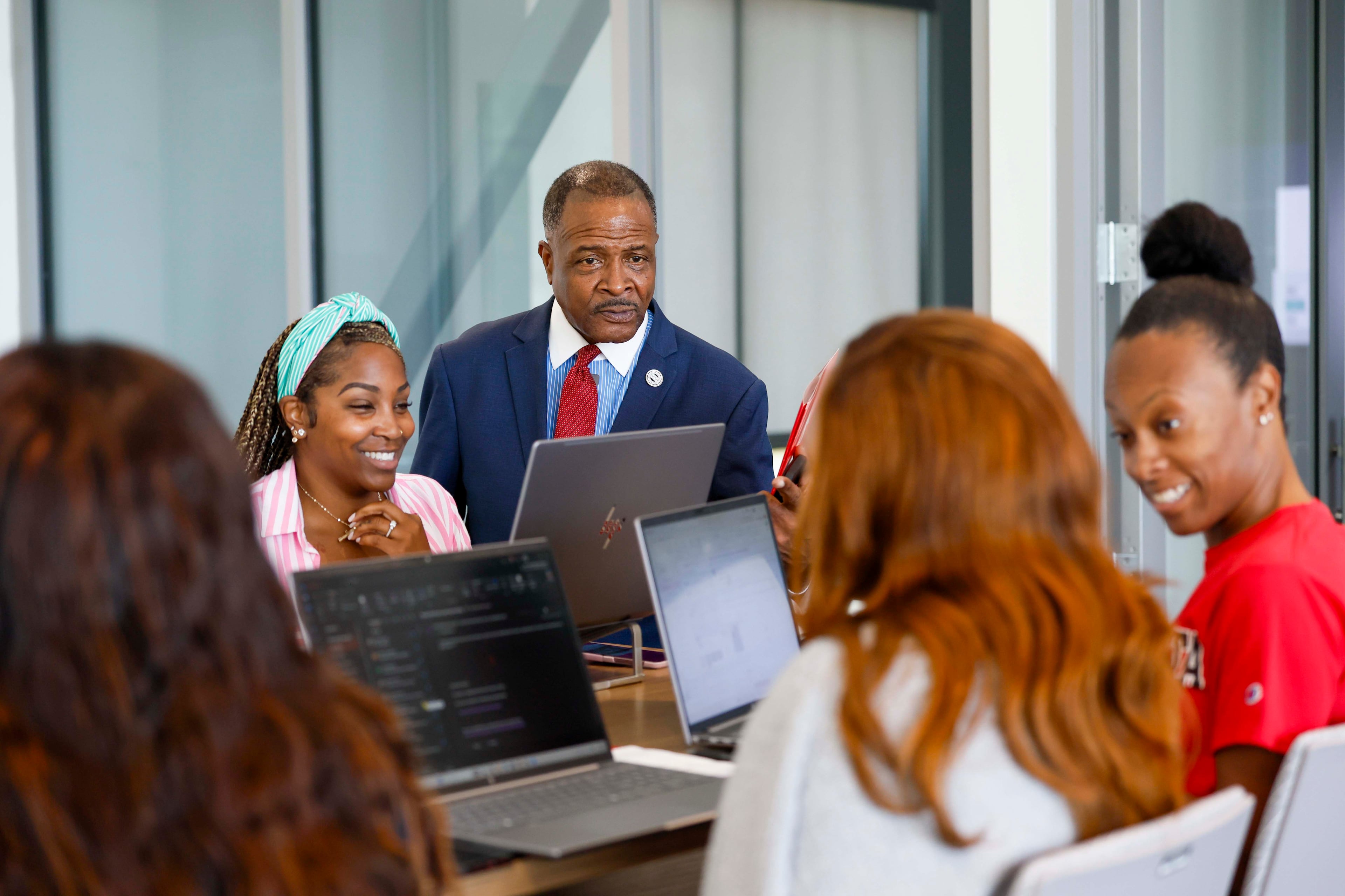 Clark Atlanta University President George French observes staff and scholars working inside the new Student Success Center on campus Wednesday, Sept. 2, 2026. The building was created to change the way students access resources, connect with others, and reach their goals. (Miguel Martinez/AJC)