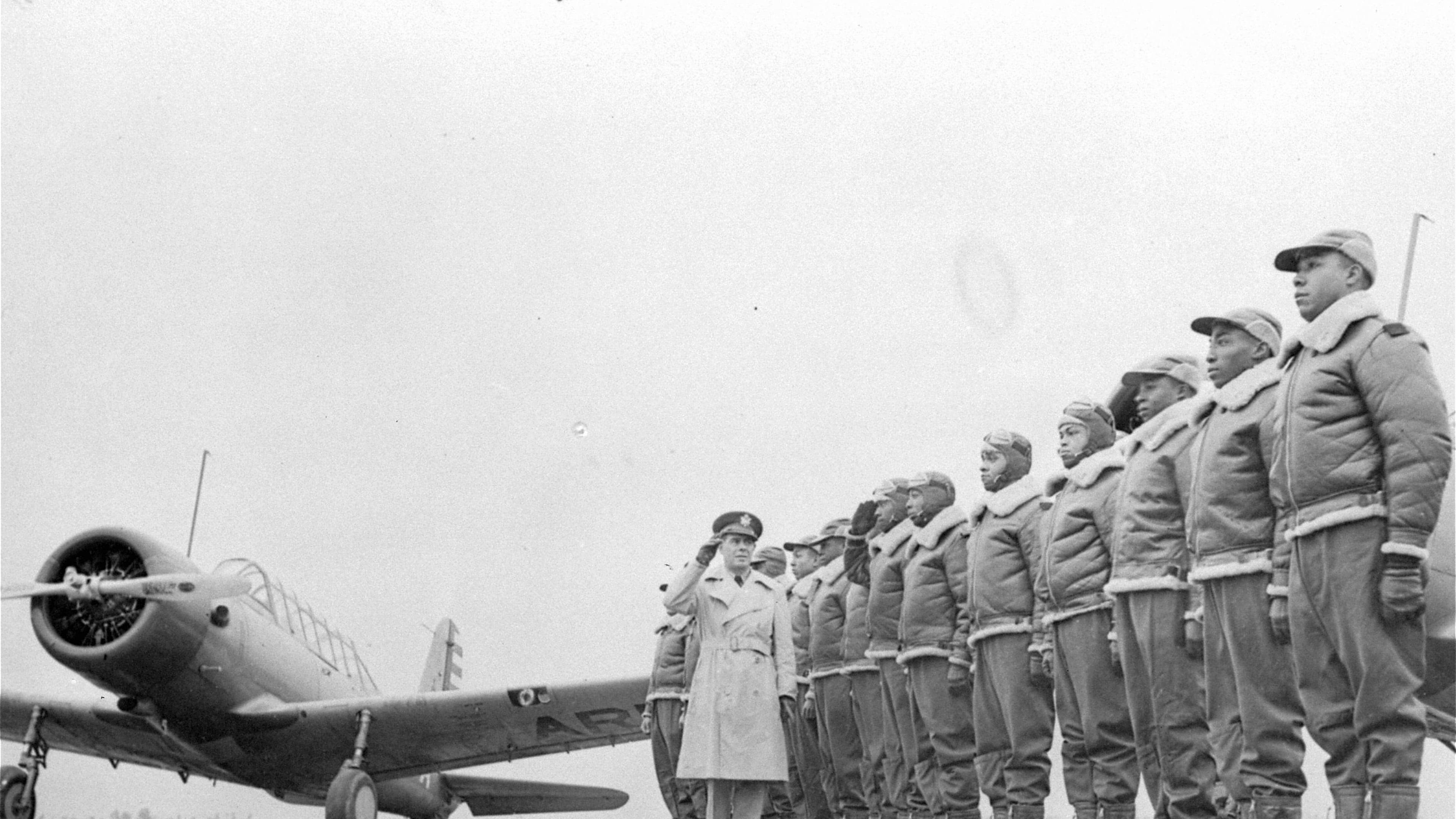 Soon to be added to the nation's fighting forces will be an all-Black aviation squadron, whose members now are in training at Tuskegee Institute, Tuskegee, Alabama. Some of the cadets at the Basic and Advanced Flying School for Negro Air Corps Cadets are shown here, Jan. 23, 1942, lined up for review with Major James A. Ellison returning the salute of Mac Ross of Dayton, Ohio, as he inspects the cadets. (U.S. Army Signal Corps/AP file photo)