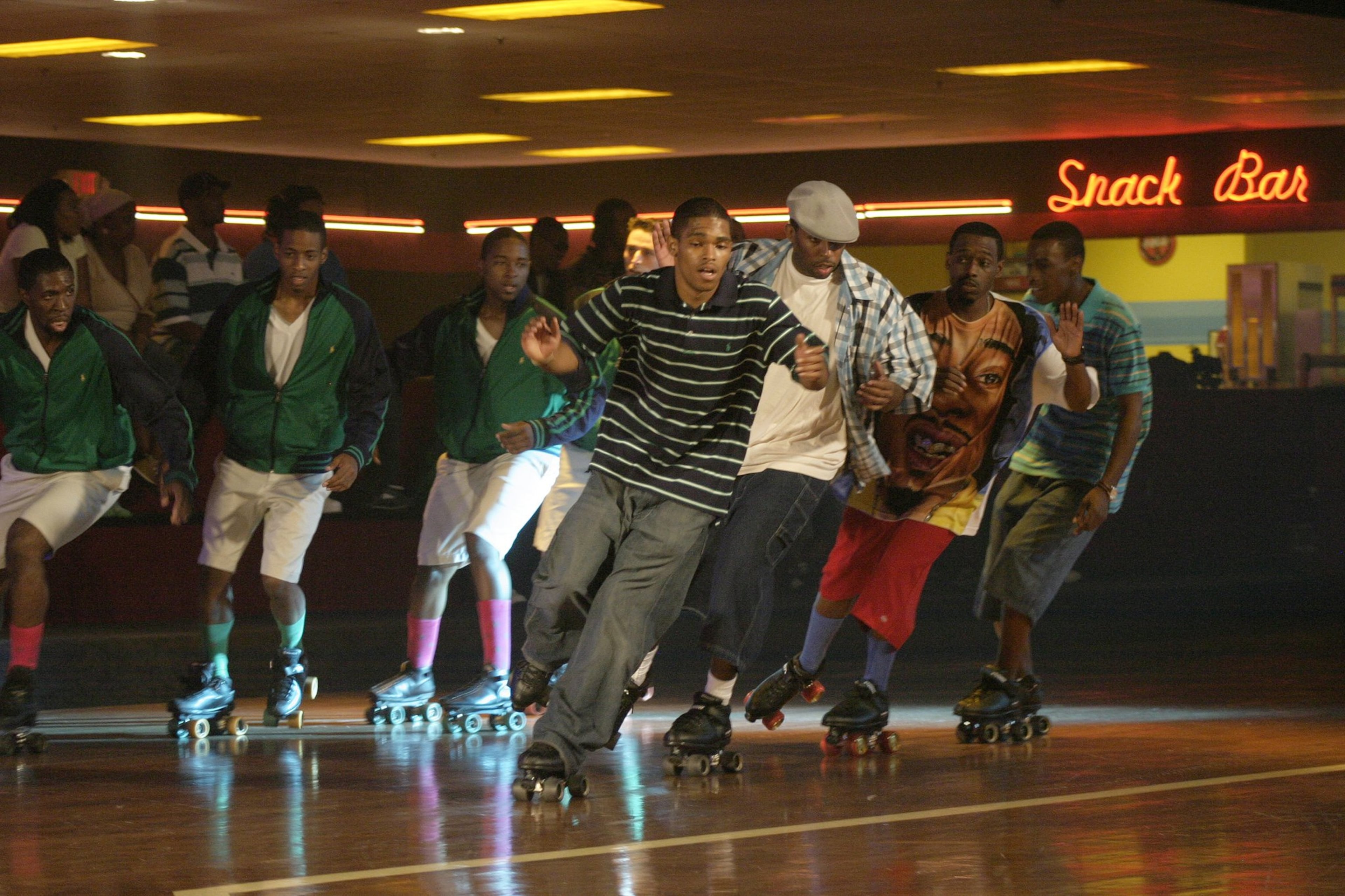 From the Archives: Actors Pierpont Greer (from left in the middle of the photo), Kenya Tyson, Hakeem Agele and James Jones doubled for the principals in a scene with the “Preps” (left in photo) during 2005 filming of "ATL," shot at Atlanta's Cascade Family Skating Rink. (Sean Drakes/Special)