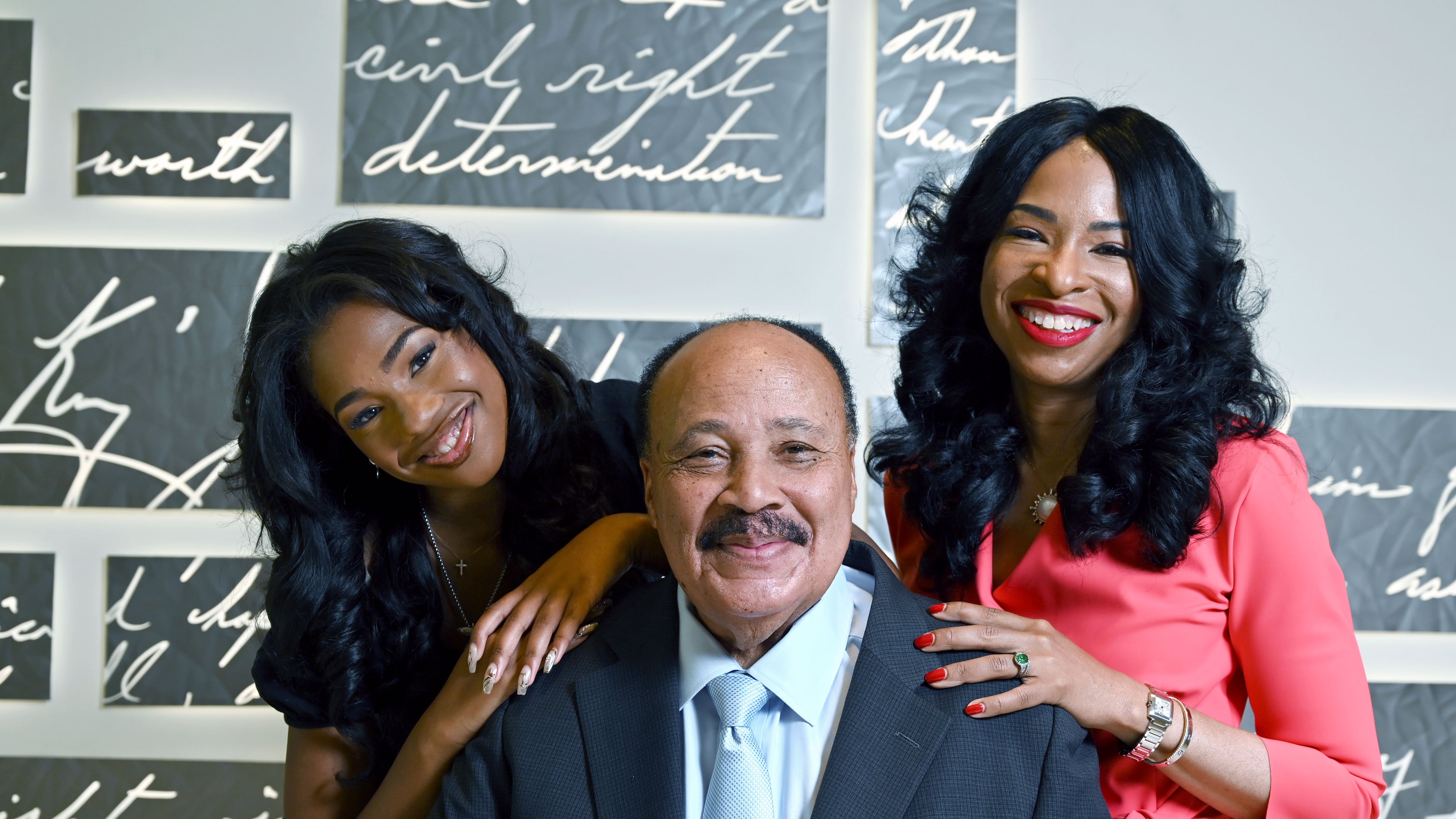 The King family — Martin Luther King III, wife Arndrea Waters King and daughter Yolanda Renee King — pose for a portrait at the National Center for Civil and Human Rights on Friday, June 12, 2026, in Atlanta. (Hyosub Shin/AJC)