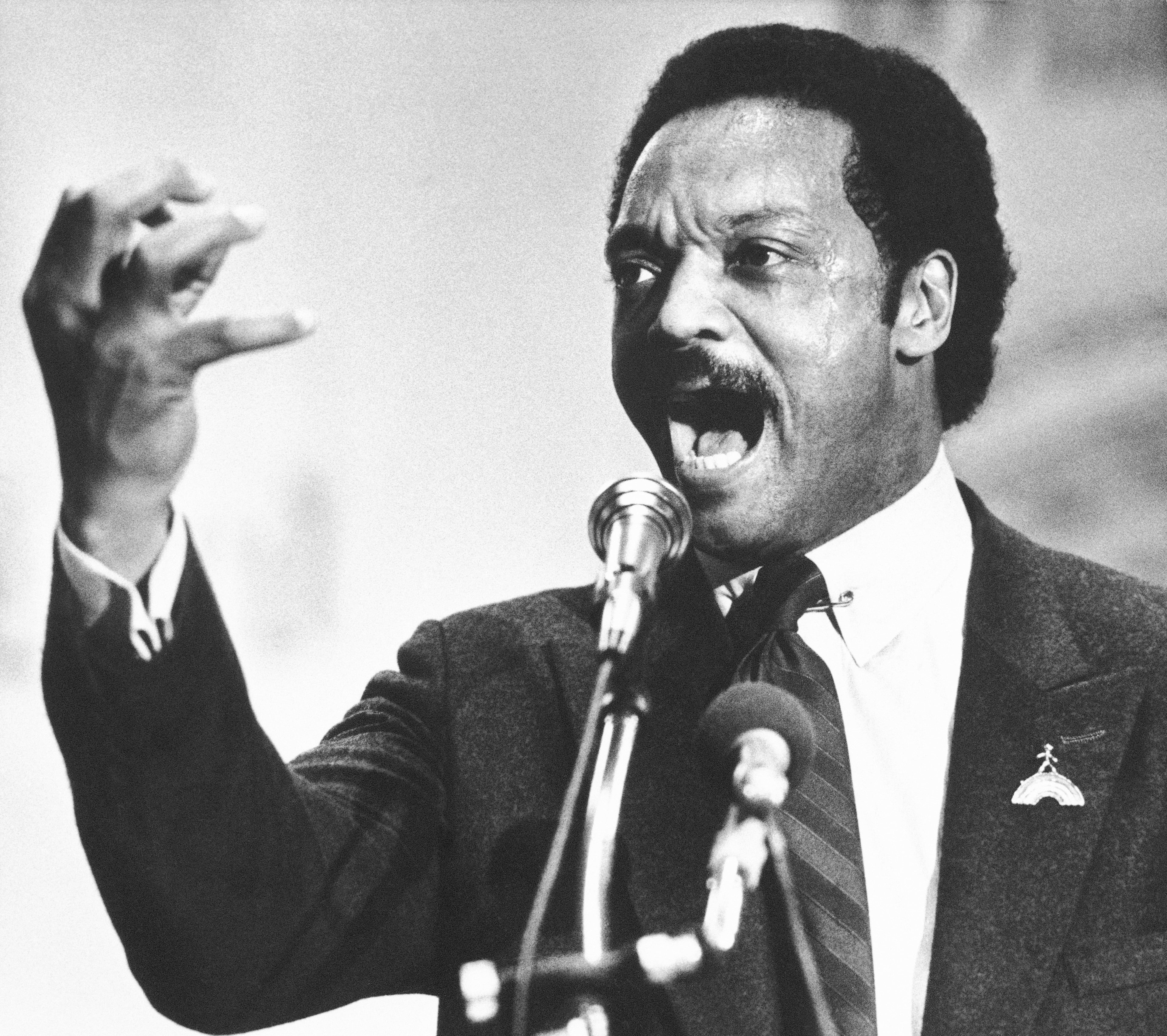 Democratic presidential candidate Jesse Jackson addresses supporters at a rally in 1984. (Rob Burns/AP)