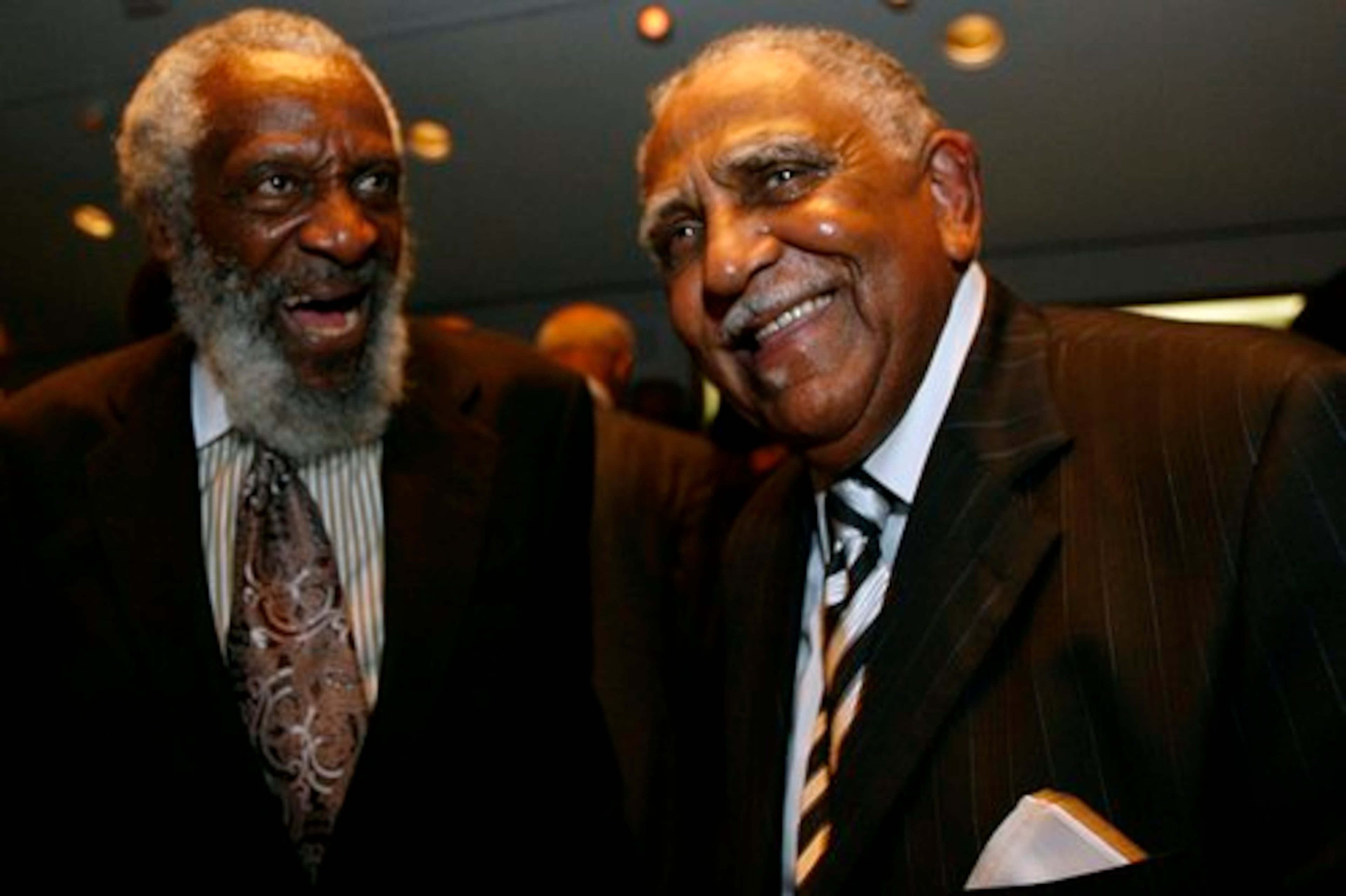 Activist and comedian Dick Gregory (left) speaks with civil rights leader Joseph Lowery during Lowery’s 85th birthday celebration at Morehouse College’s King Chapel on Thursday, Oct. 19, 2006, in Atlanta. (Mikki K. Harris/AJC)