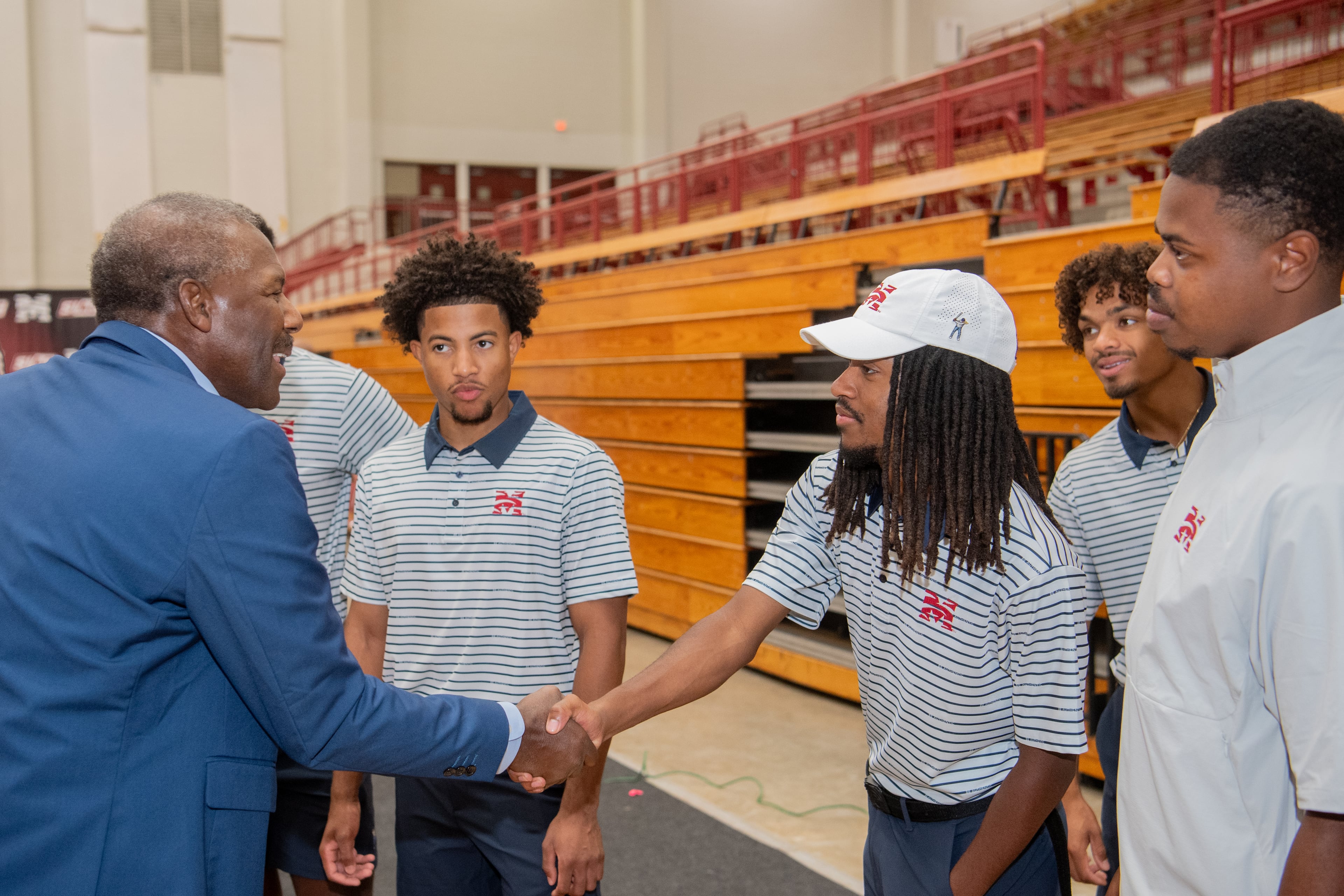 From the Archives: Ralph Stokes, VP of PGA TOUR Superstore, (L) greets Morehouse golfer Yusouf Gladney at the ribbon cutting for the new indoor practice facility. (Courtesy of Kate Awtrey-Kn)