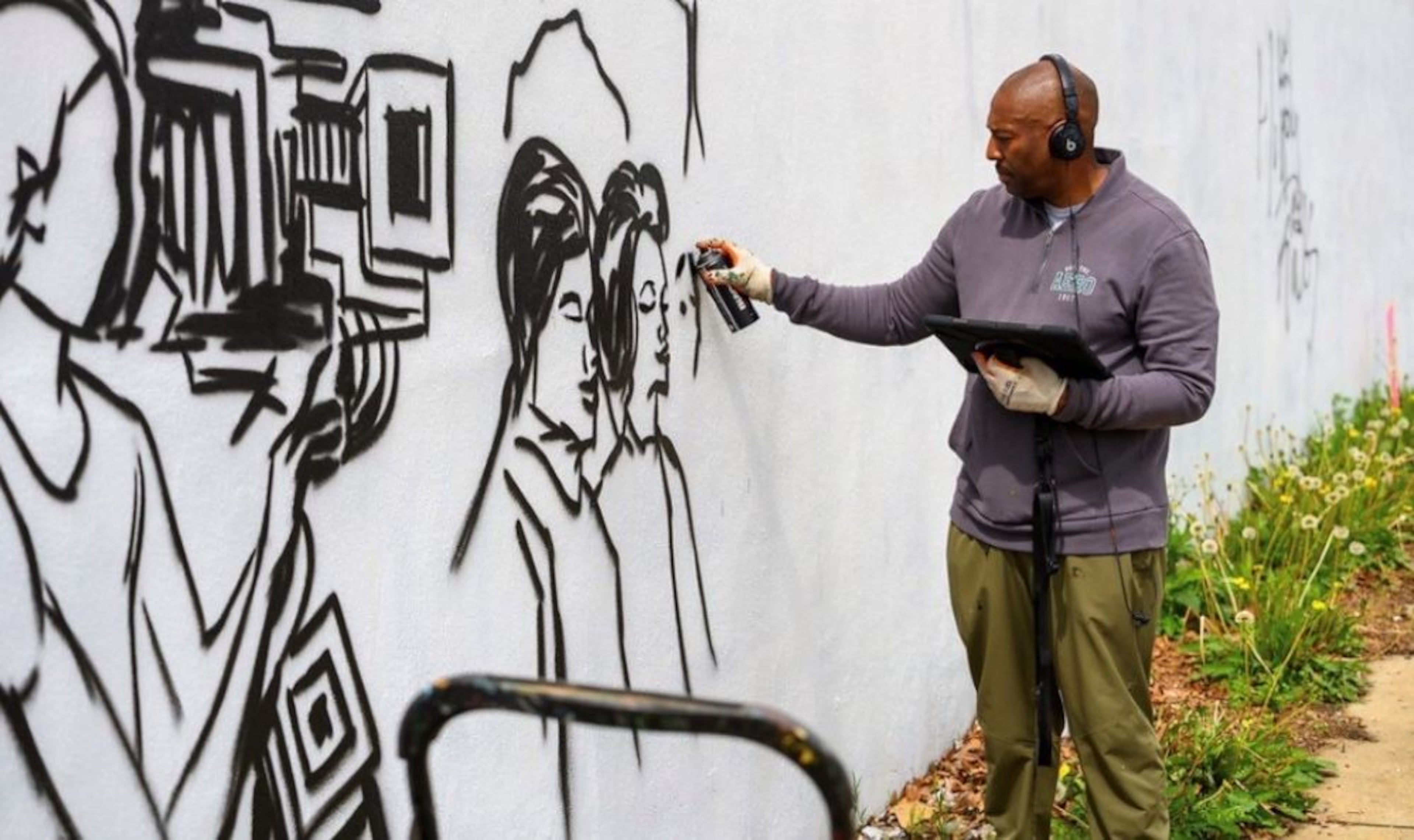 Barksdale wants to remind you of Blandtown’s lost history with a “public art gallery” in the neighborhood. “I’m trying to tell the story about how powerful the individuals who came before us really were,” he says. (Ellis Vener)