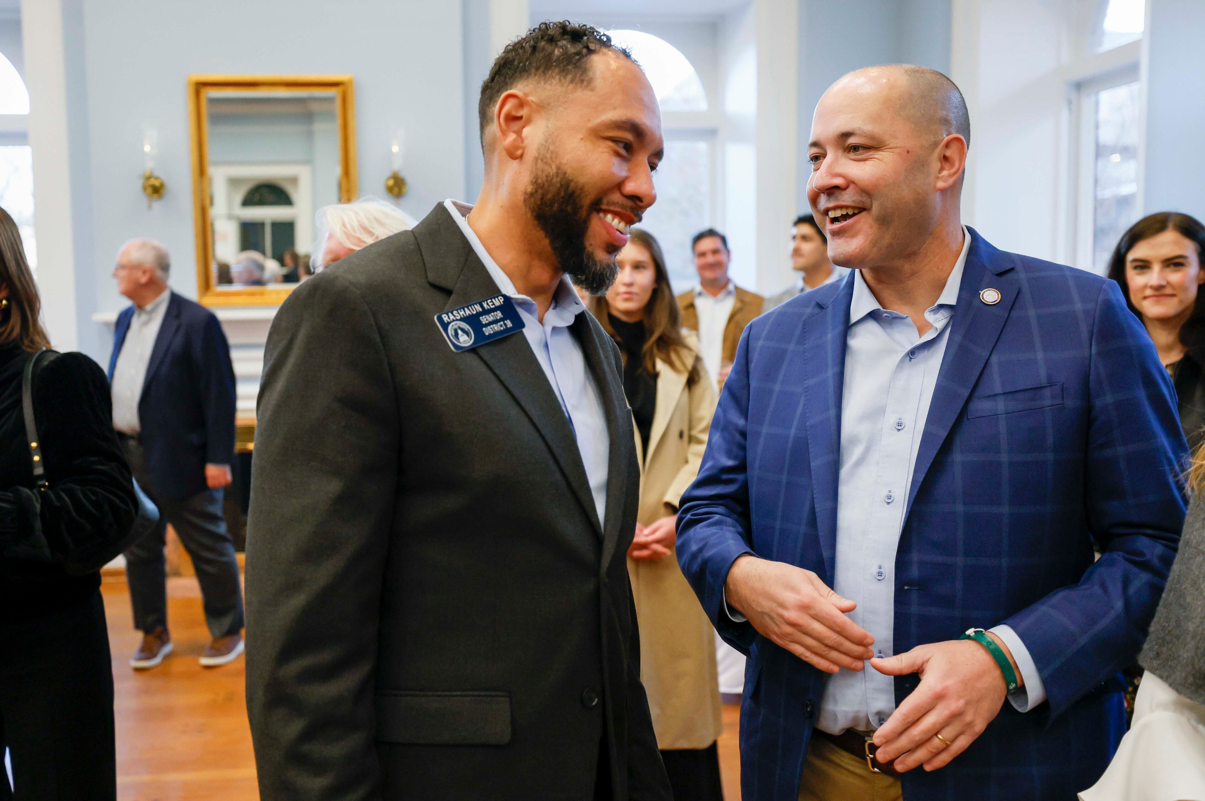 Georgia Attorney General Chris Carr (right) confers with state Sen. RaShaun Kemp, D-Atlanta, at the Wild Hog supper, the traditional kickoff to the legislative session in Atlanta, on Sunday, Jan. 11, 2026. (Miguel Martinez/AJC)