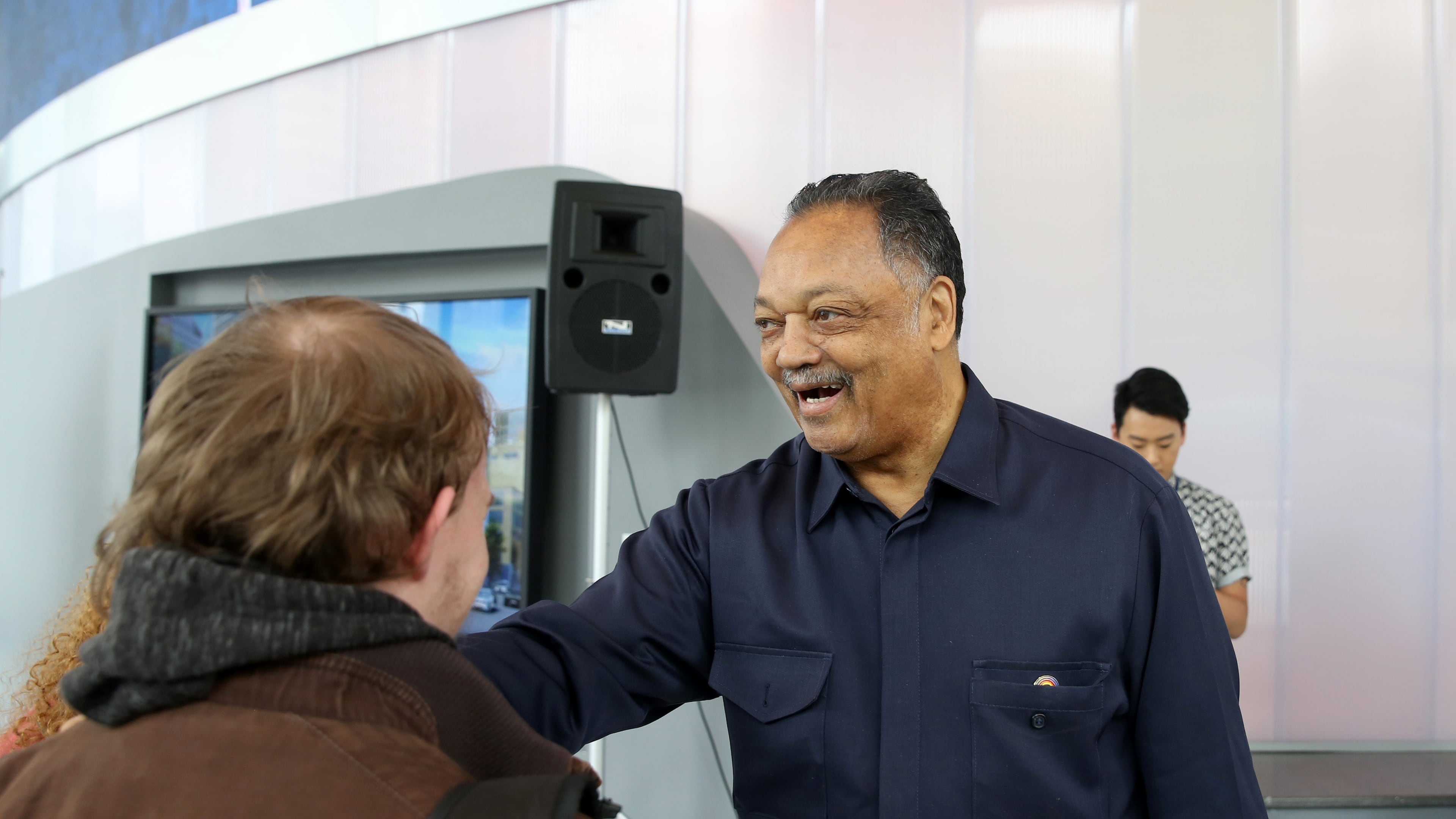 The Rev. Jesse Jackson greets students before a March event at the Georgia State University School of Flim, Media & Theatre. (Jason Getz/AJC)