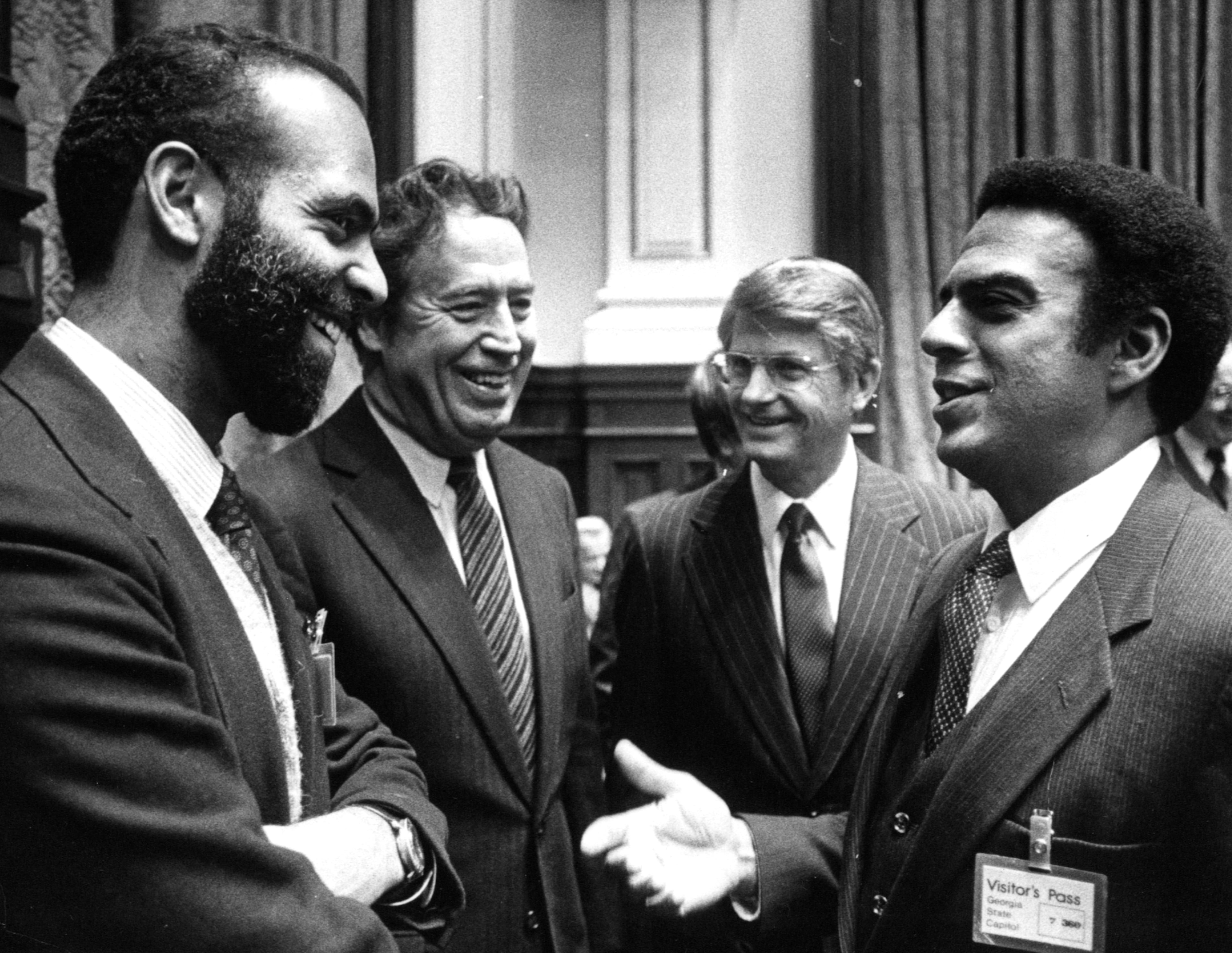 Michael Lomax (from left), with developer John Portman, Lt. Gov. Zell Miller and Andew Young in the state Senate. Lomax once challenged Young to be mayor of Atlanta. (AJC file)