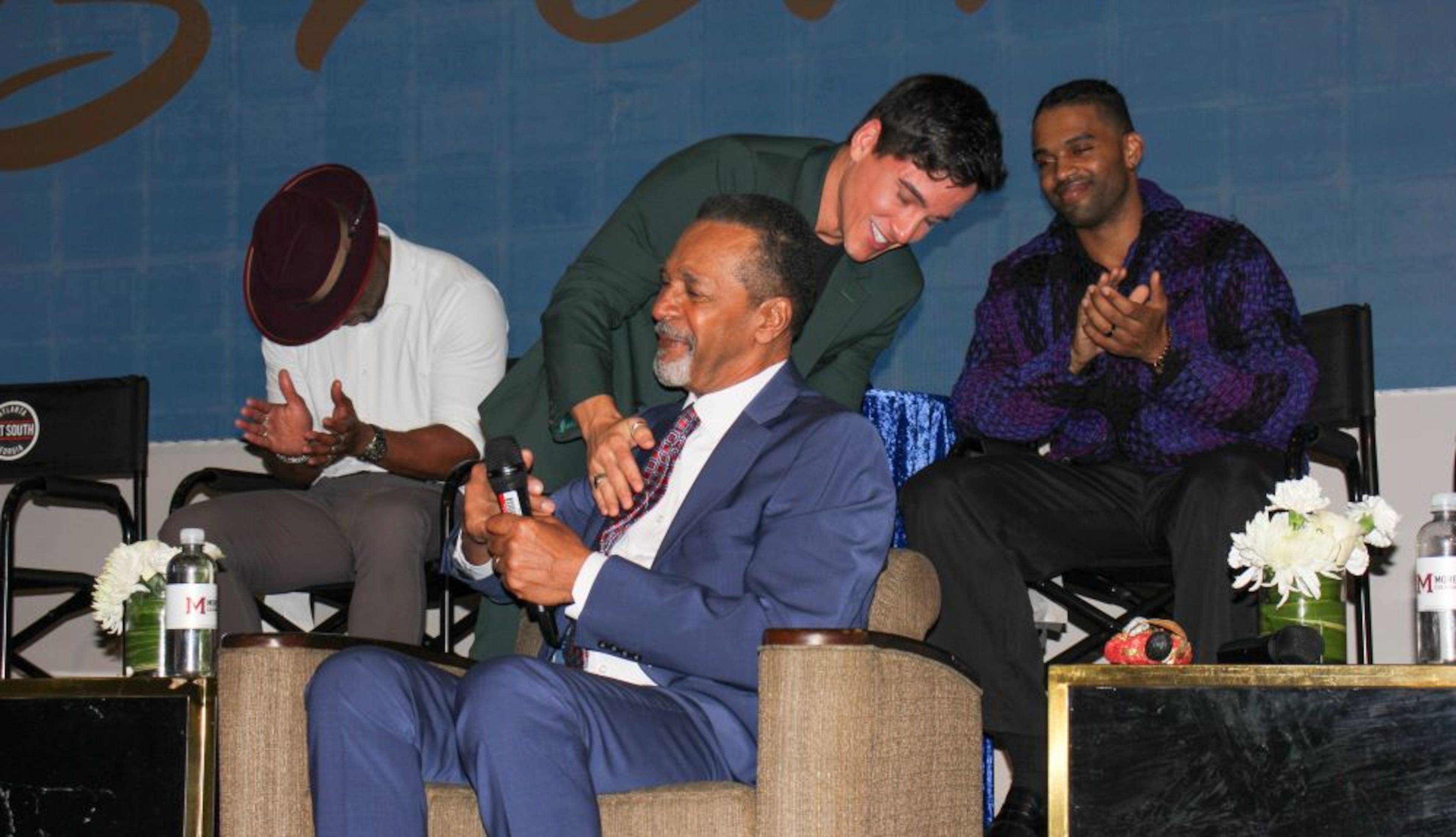 Actor Mike Manning hugs Clifton Davis during BronzeLens Film Festival's Brunch with the Brothers at Morehouse College on Sunday. (Courtesy of Vernell Dillingham)