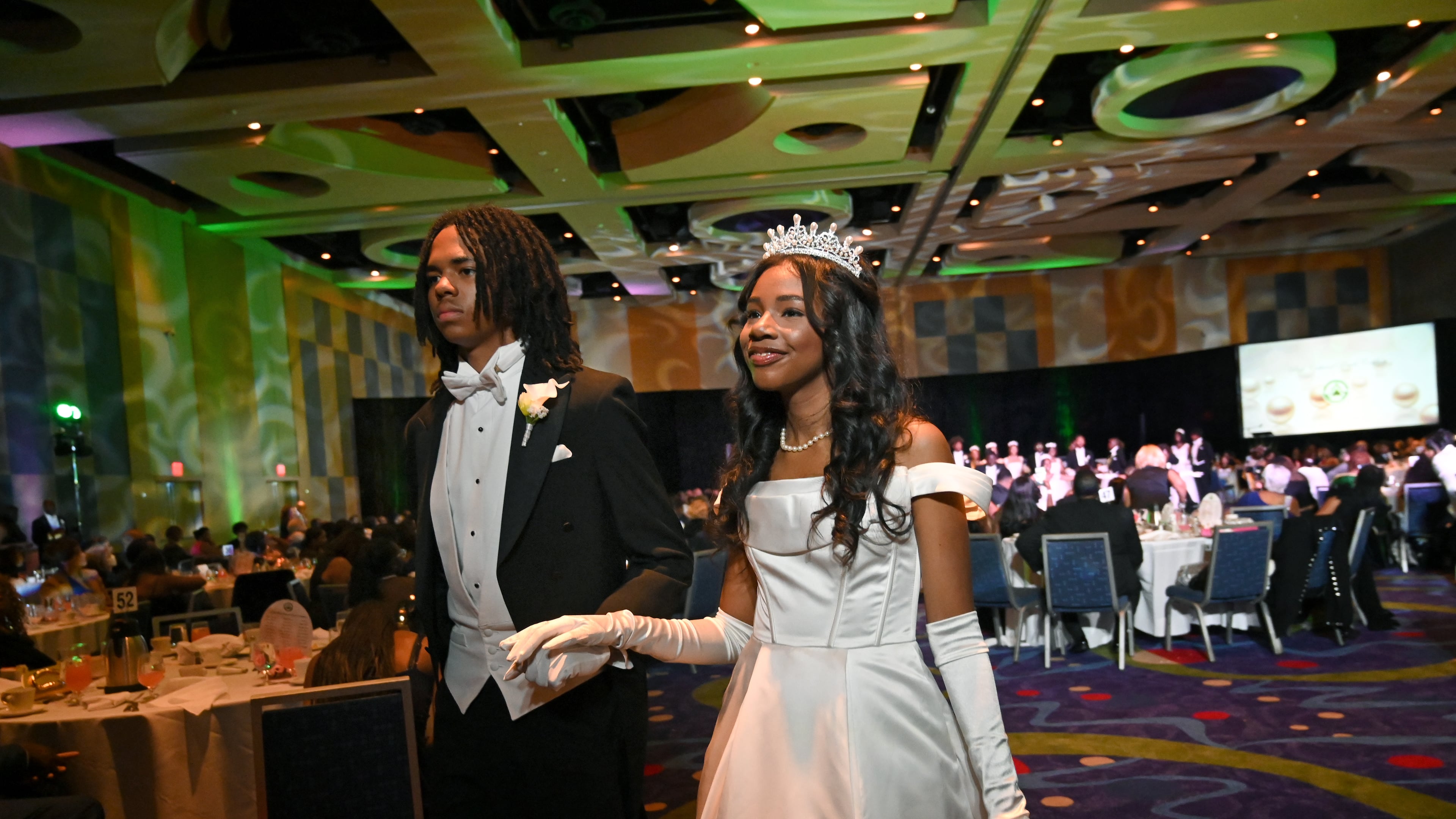 Debutante Yolanda Renee King is escorted by Brandon Coleman during the 2026 Pink Cultured Pearls Cotillion. (Hyosub Shin/AJC)