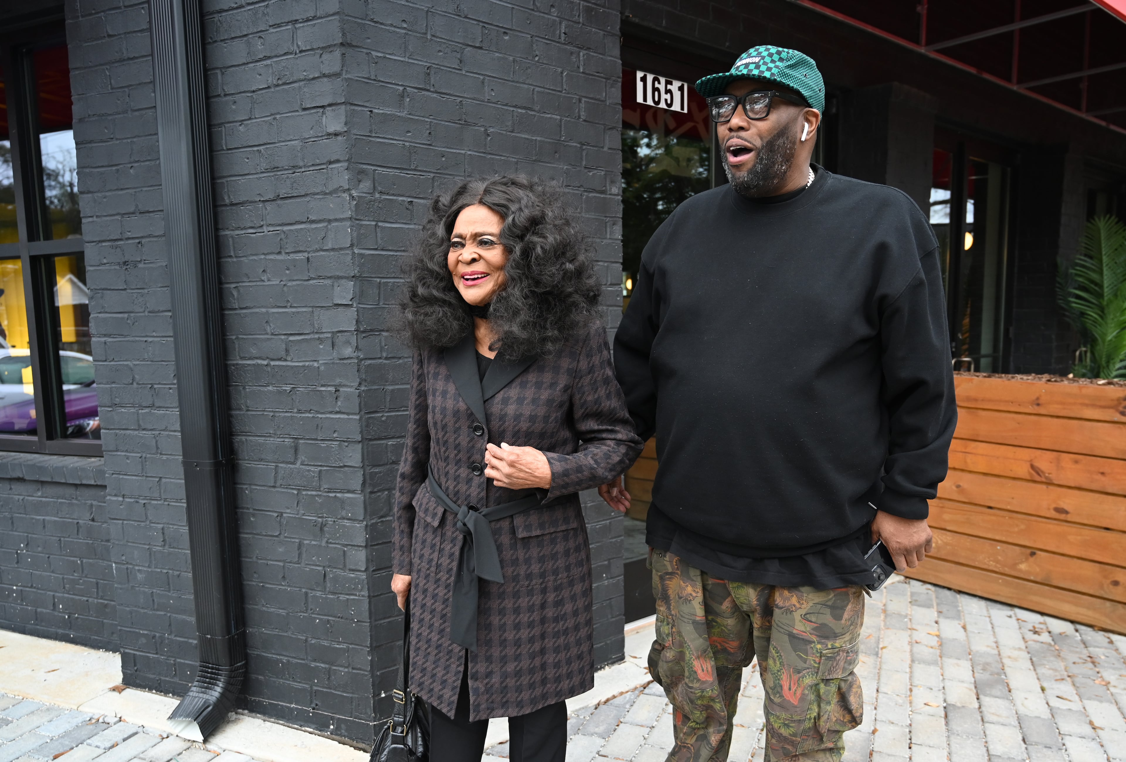 Rapper Killer Mike (right) with former Bankhead Seafood owner Helen Harden during the restaurant's soft opening in November 2024 in Atlanta. (Hyosub Shin/AJC 2024)
