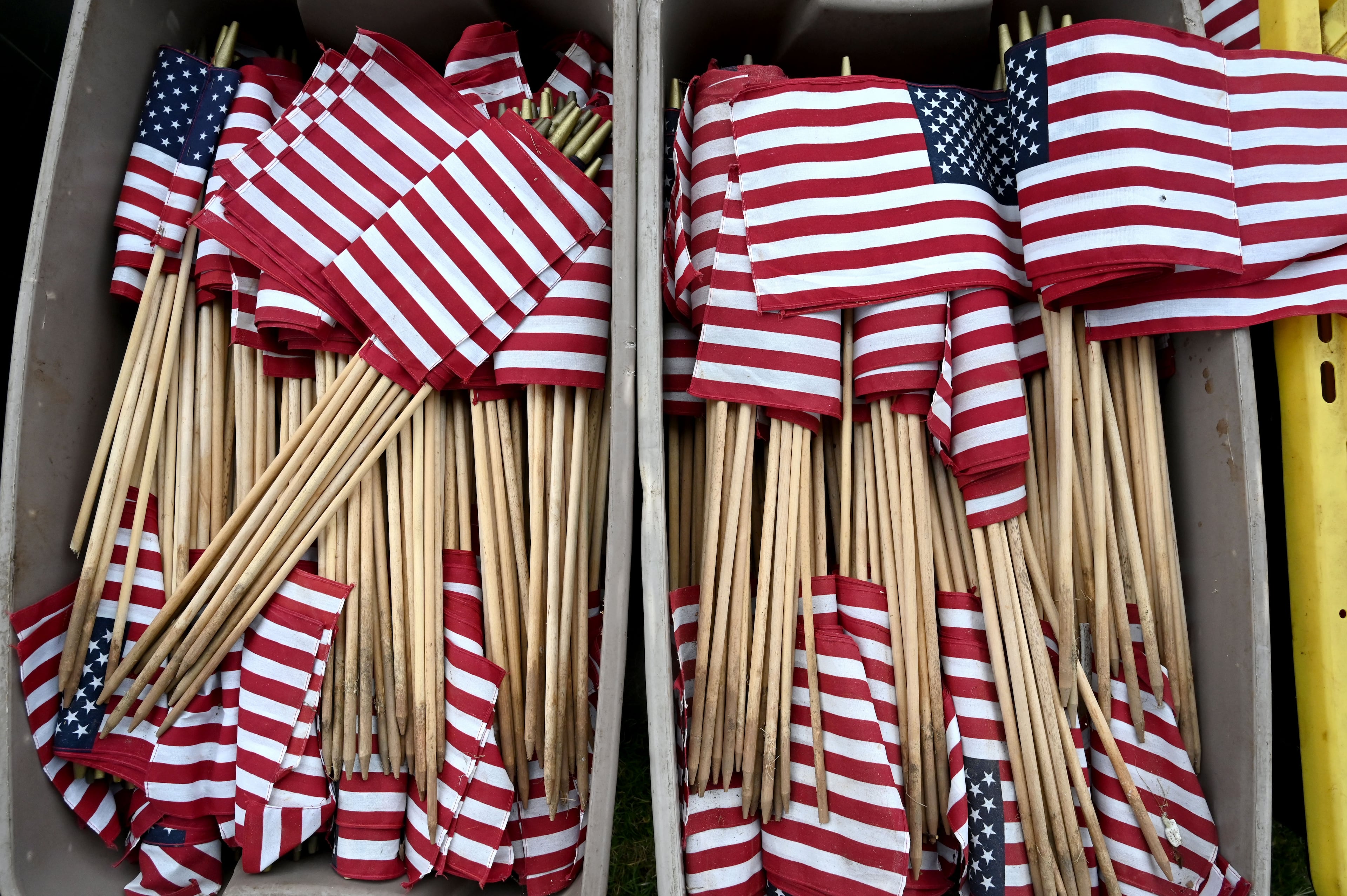 Waving American flags is synonymous with the Fourth of July. (Hyosub Shin/AJC)