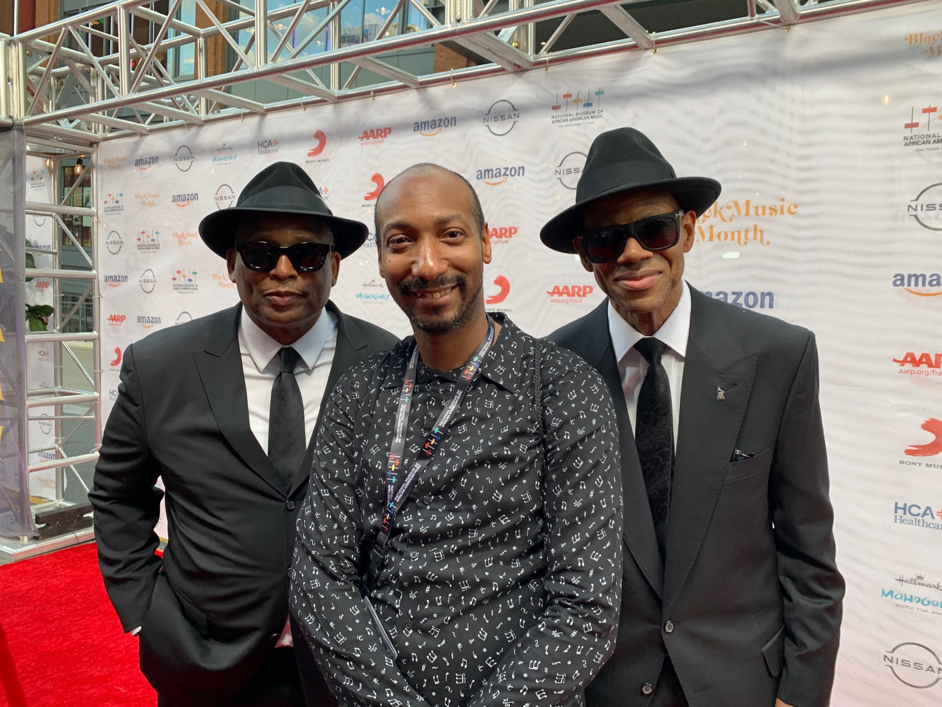 UATL Black culture reporter Christopher A. Daniel poses with Grammy-winning songwriting and production duo Jimmy Jam (r.) and Terry Lewis (l.) at the National Museum for African American Music in Nashville, Tennessee, on Jun. 17, 2021. (Courtesy of DJ Blak Magic)